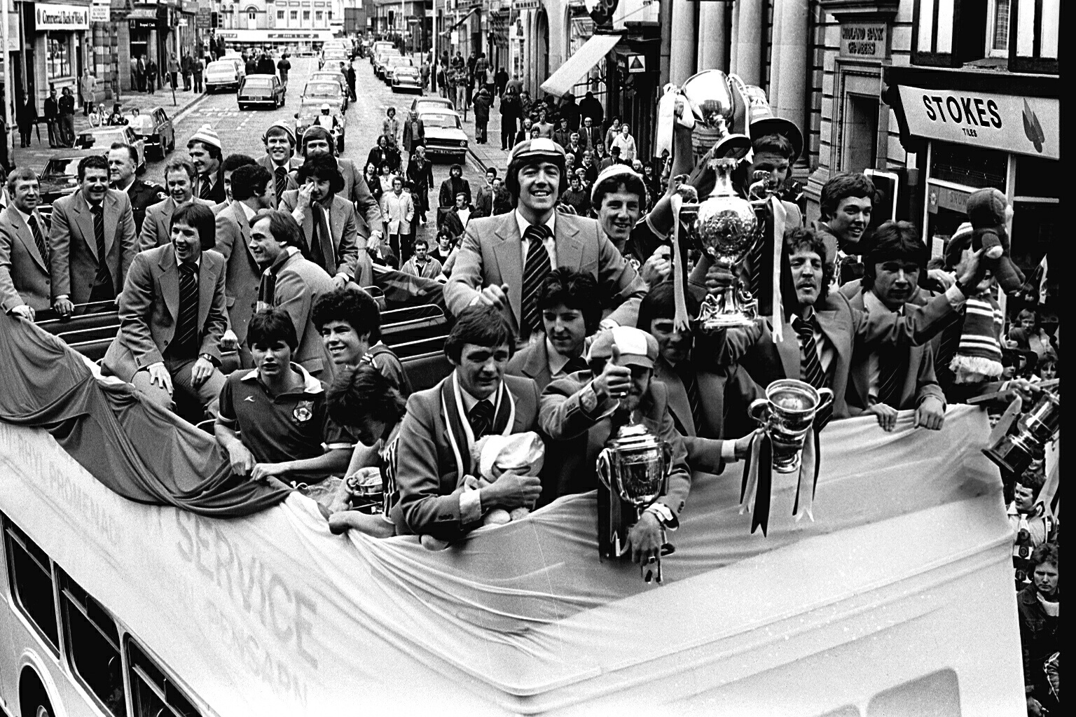 Wrexham players in an open topped bus parade, 1978