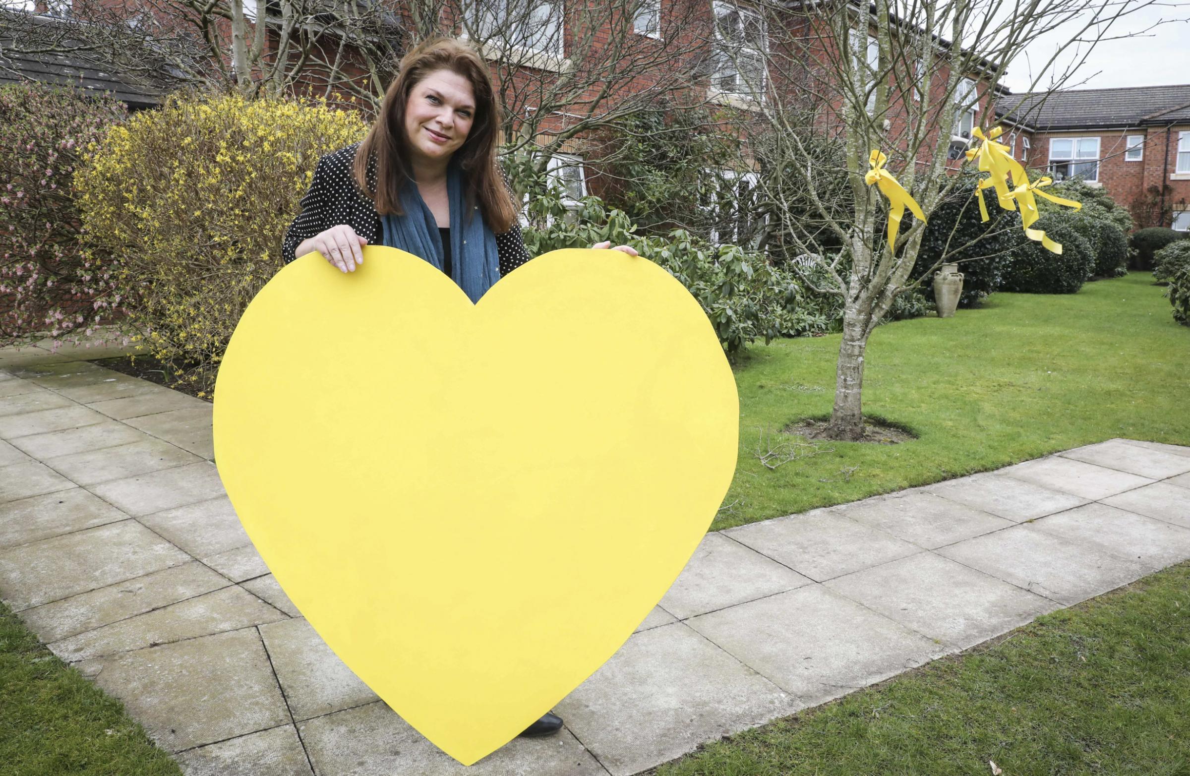 Pendine Park, Summerhill Pendine Park are taking a full part in Light up Wales in memory of Covid victims Artist in residence Sarah Edwards has been working with residents to make Yellow hearts to hang in the windows, yellow ribbons to put in the trees