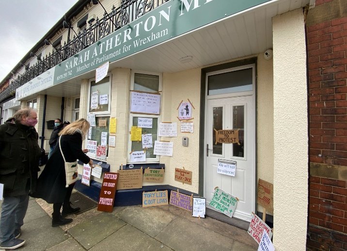 Protestors left placards outside Sarah Atherton MPs office. 