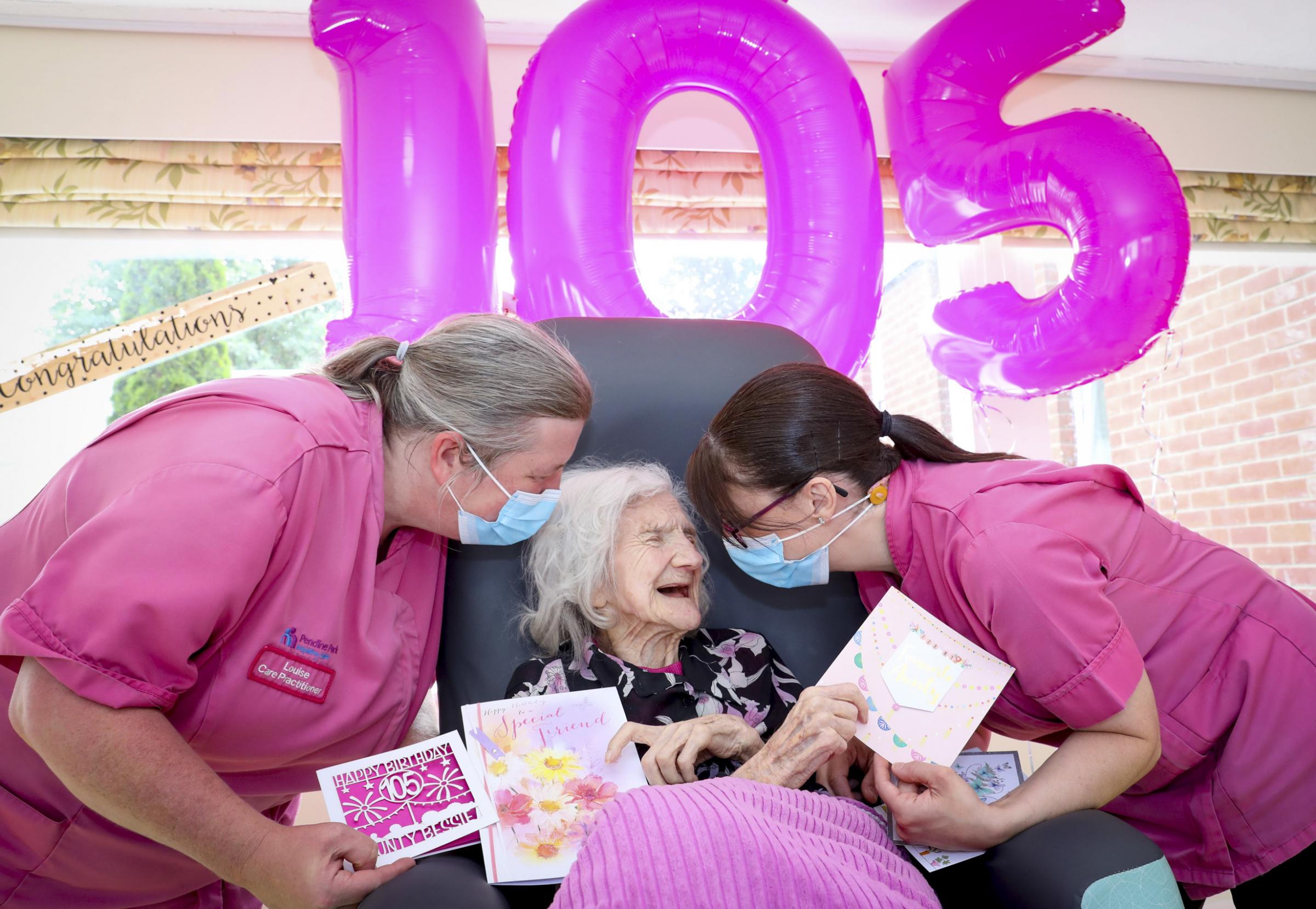 Pendine Park, Hillbury Mrs Martha Elizabeth Hughes, who is known universally as Bessie celebrates her 105th birthday with Care Practitioners Louise Parry and Rowena Roberts