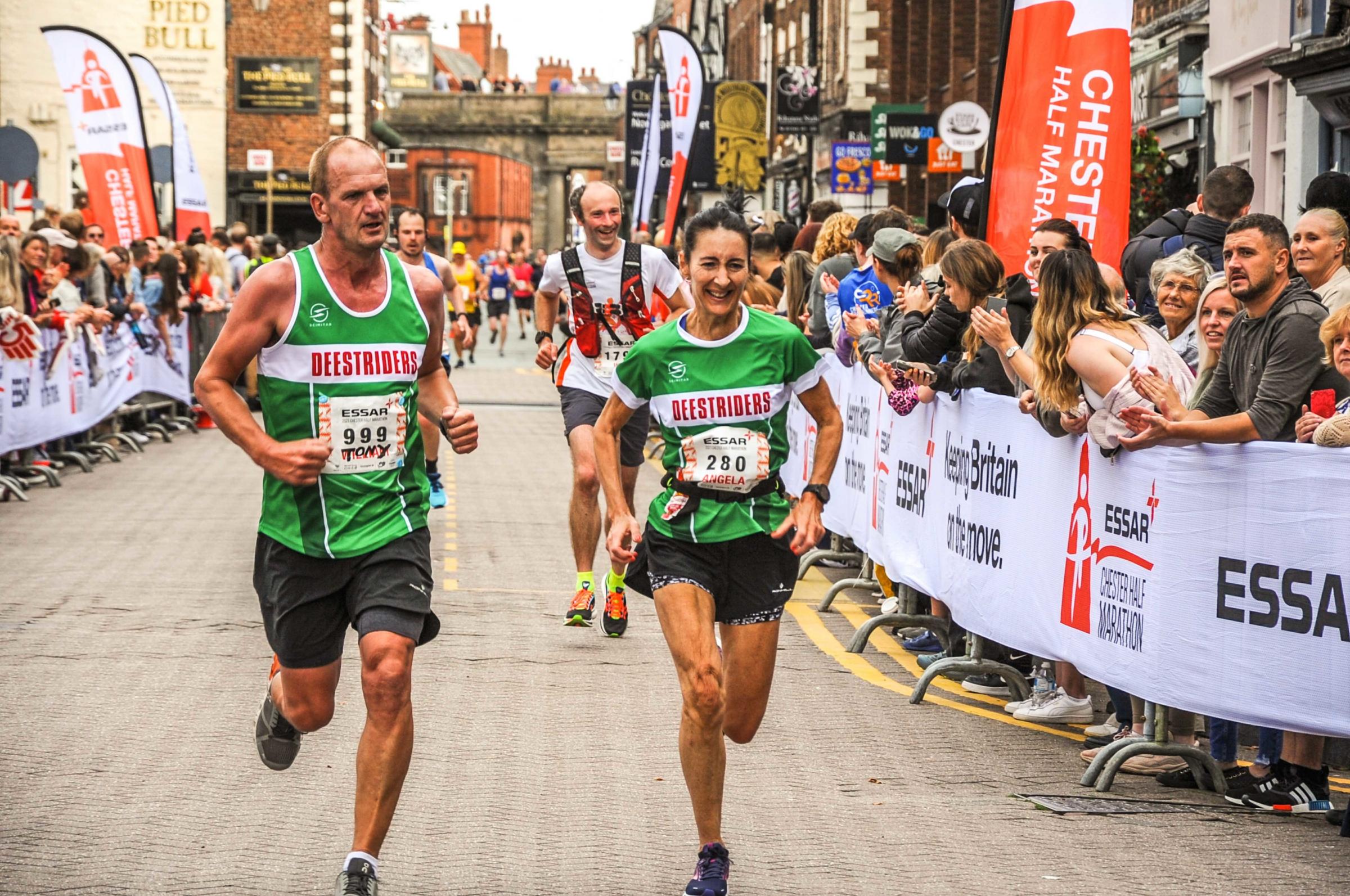 Chester Racecourse and Chester Town Hall, Essar 2021 Chester Half Marathon. Picture crossing the Deestrider runners. SW19092021.