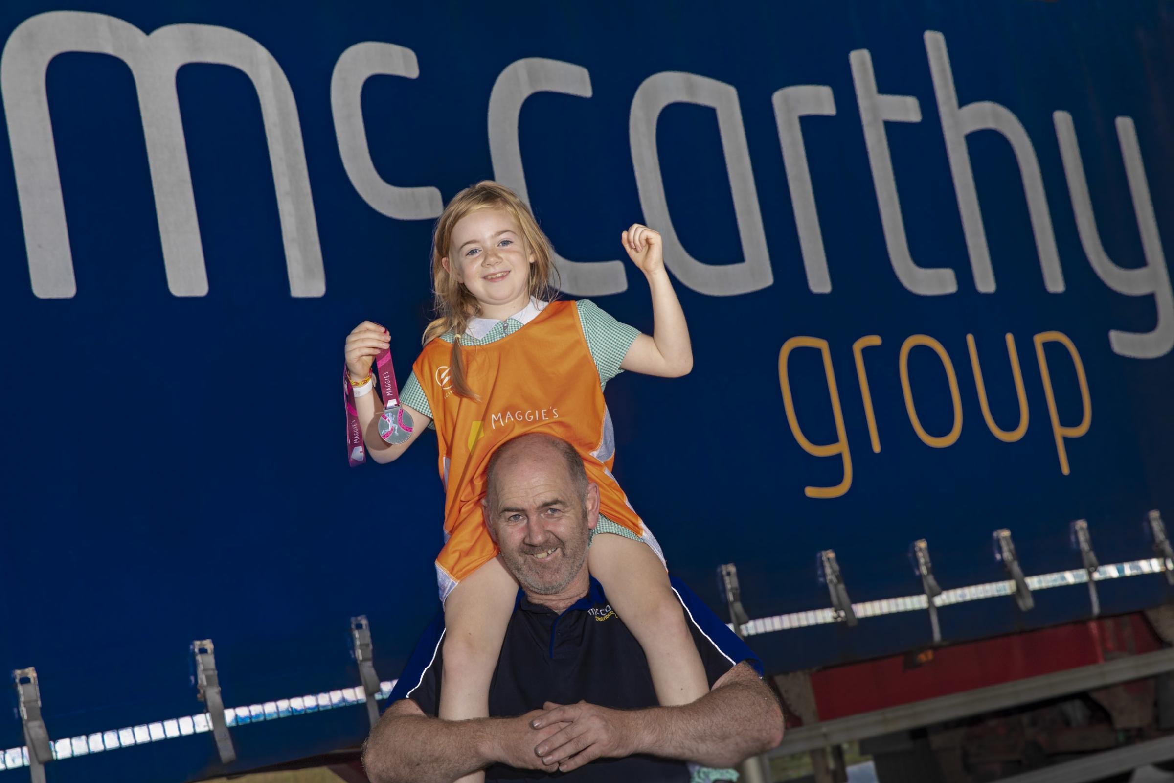 McCarthy driver Brian Edwards and his Daughter Lily,8 raise money from Maggies 50 mile run. Picture Mandy Jones