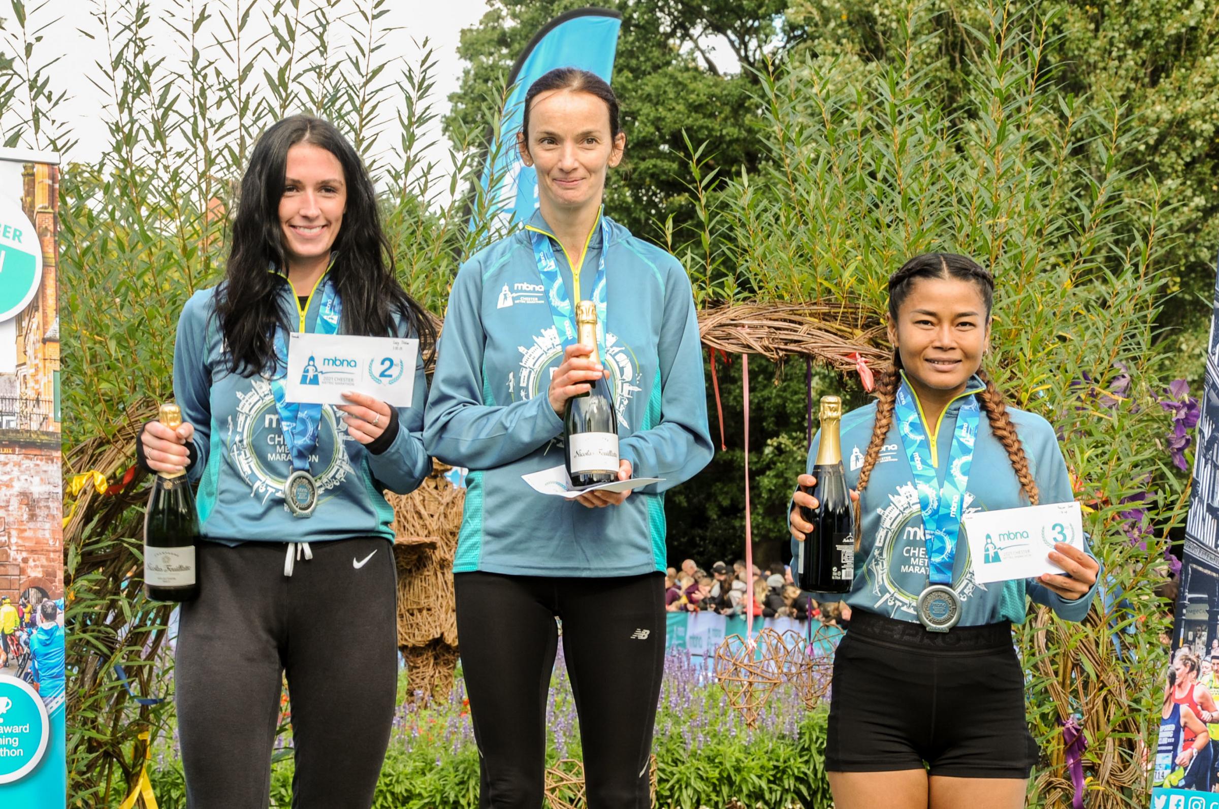 Chester Racecourse start and finish Grosvenor Park, Mbna Chester Marathon, Metric and Mini Marathon. Picture Centre first place Metric Marathon Lady Elizabeth Renondenu, second place Lucy Tilston and third place Paiwan Dodd. SW03102021.