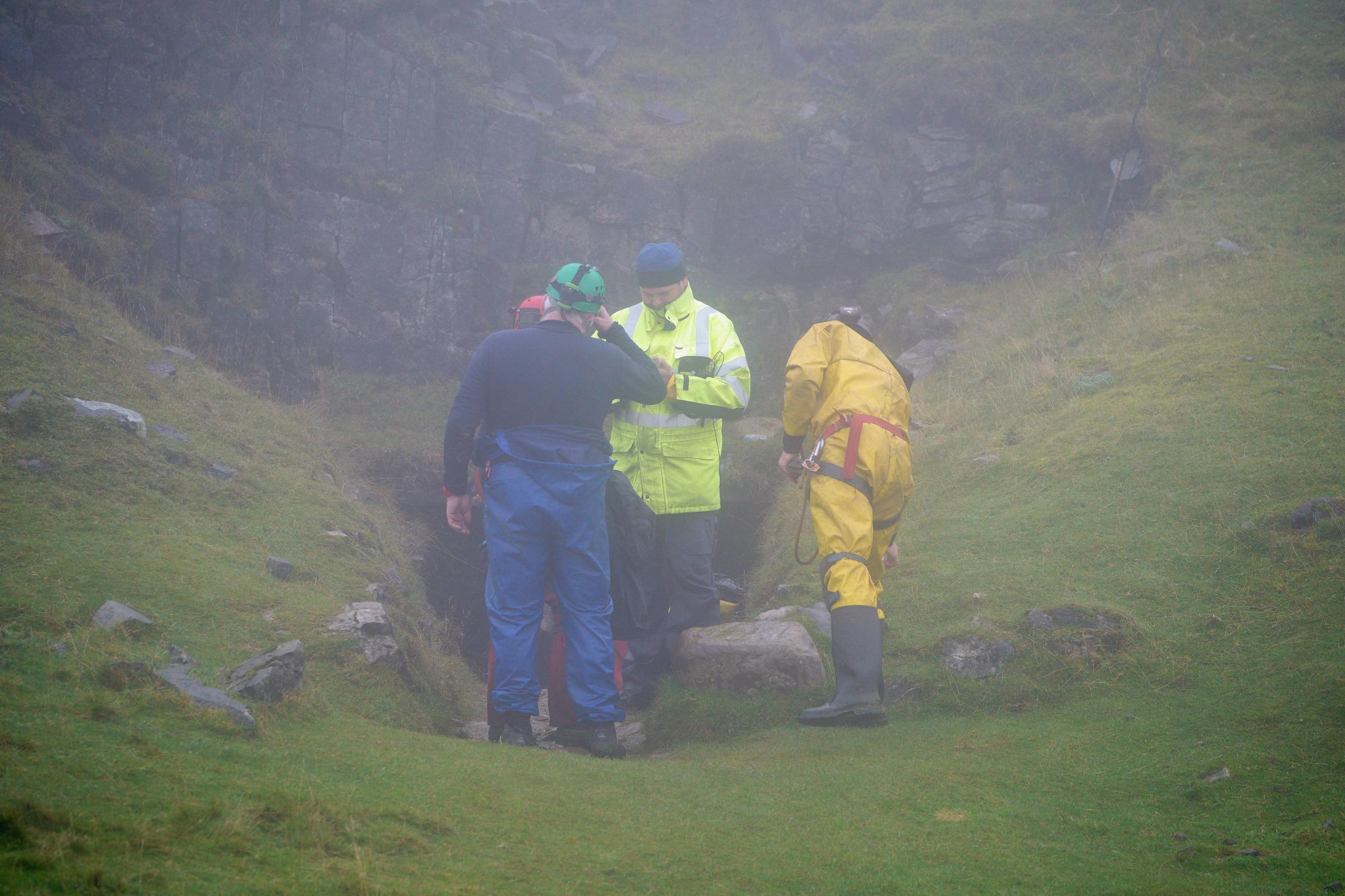 Rescuers at the entrance of the Ogof Ffynnon Ddu cave system near Penwyllt, Powys in the Brecon Beacons, Wales, as rescue mission is underway to save a man who has been trapped inside a cave, after falling on Saturday. Because of the injuries suffered in