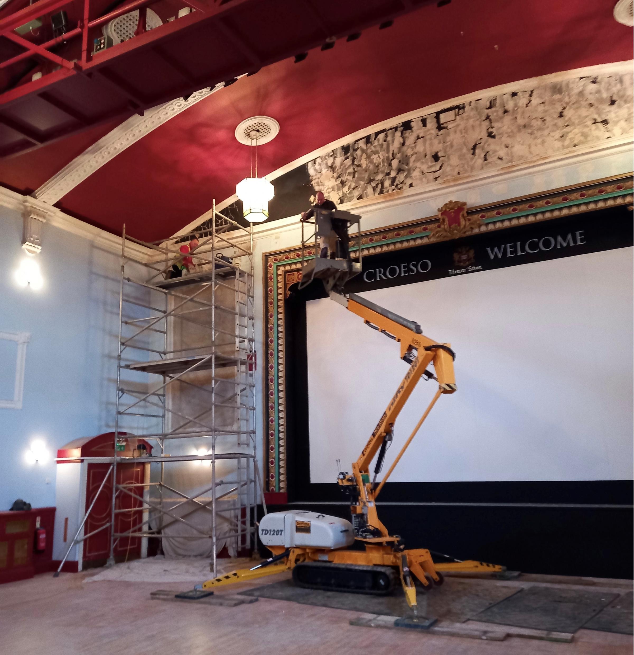 Work on water damage above the stage at the Stiwt Theatre in Rhos.