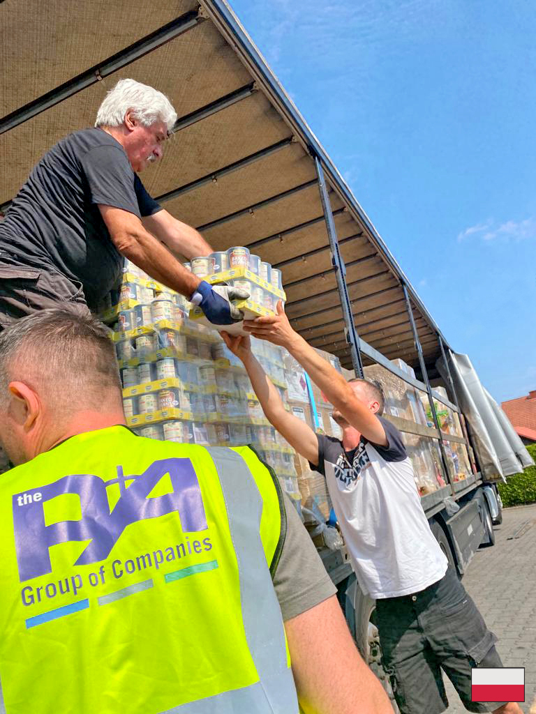 P&A Group and partner’s articulated lorry filled with Aid arriving and being unloaded at Caritas warehouse on the Polish and Ukraine border.