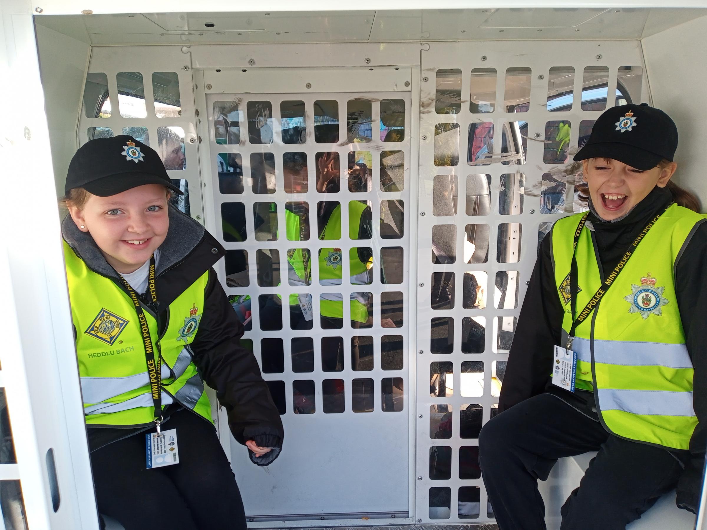 Westwood Primary’s Mini Police checkout the cell in the back of the police van.