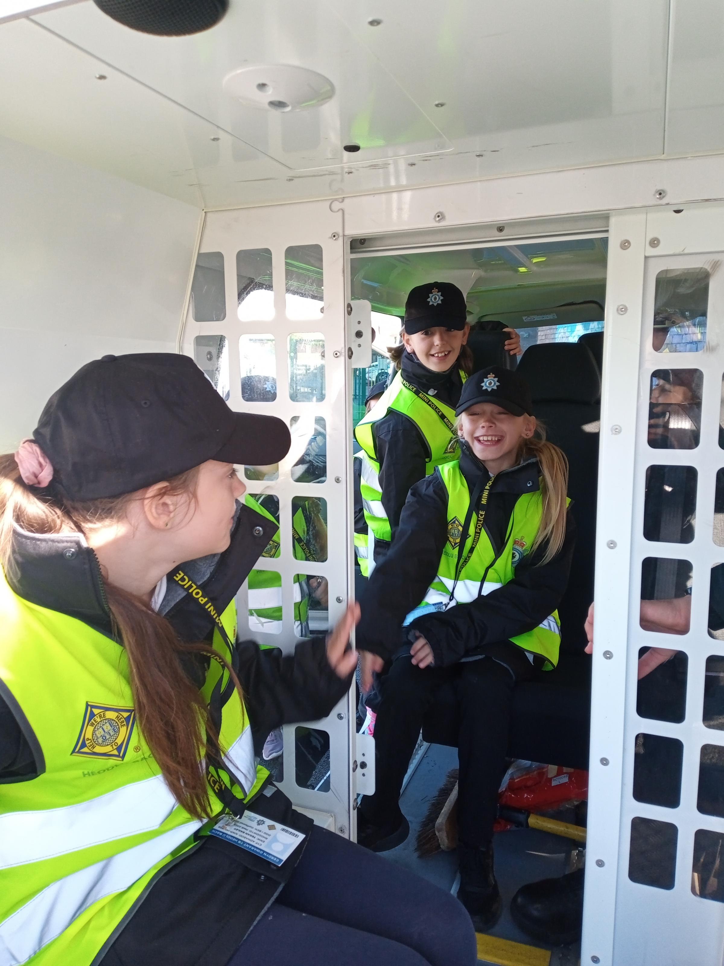 Westwood Primary’s Mini Police checkout the cell in the back of the police van.