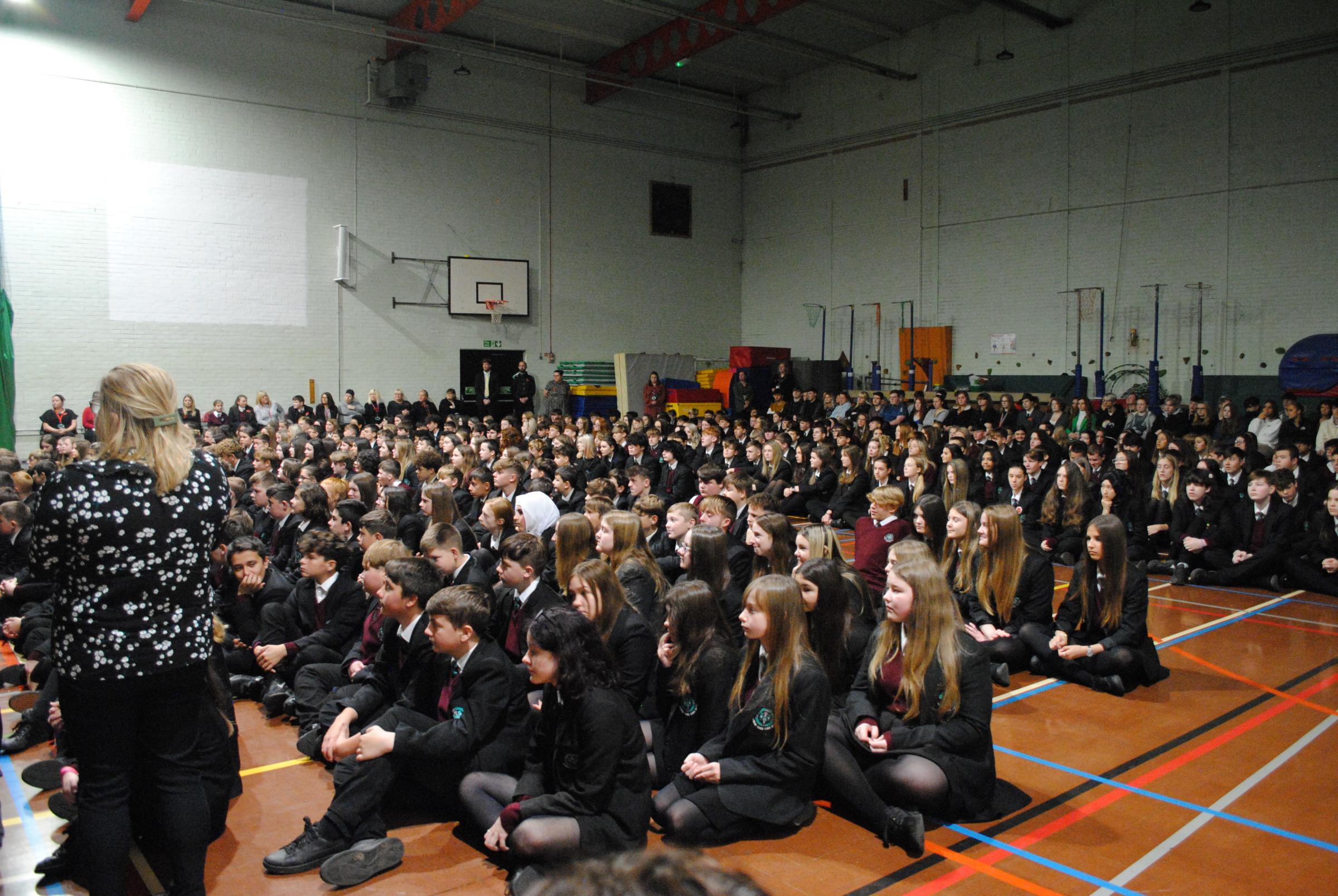 Staff and students await the start of the service.