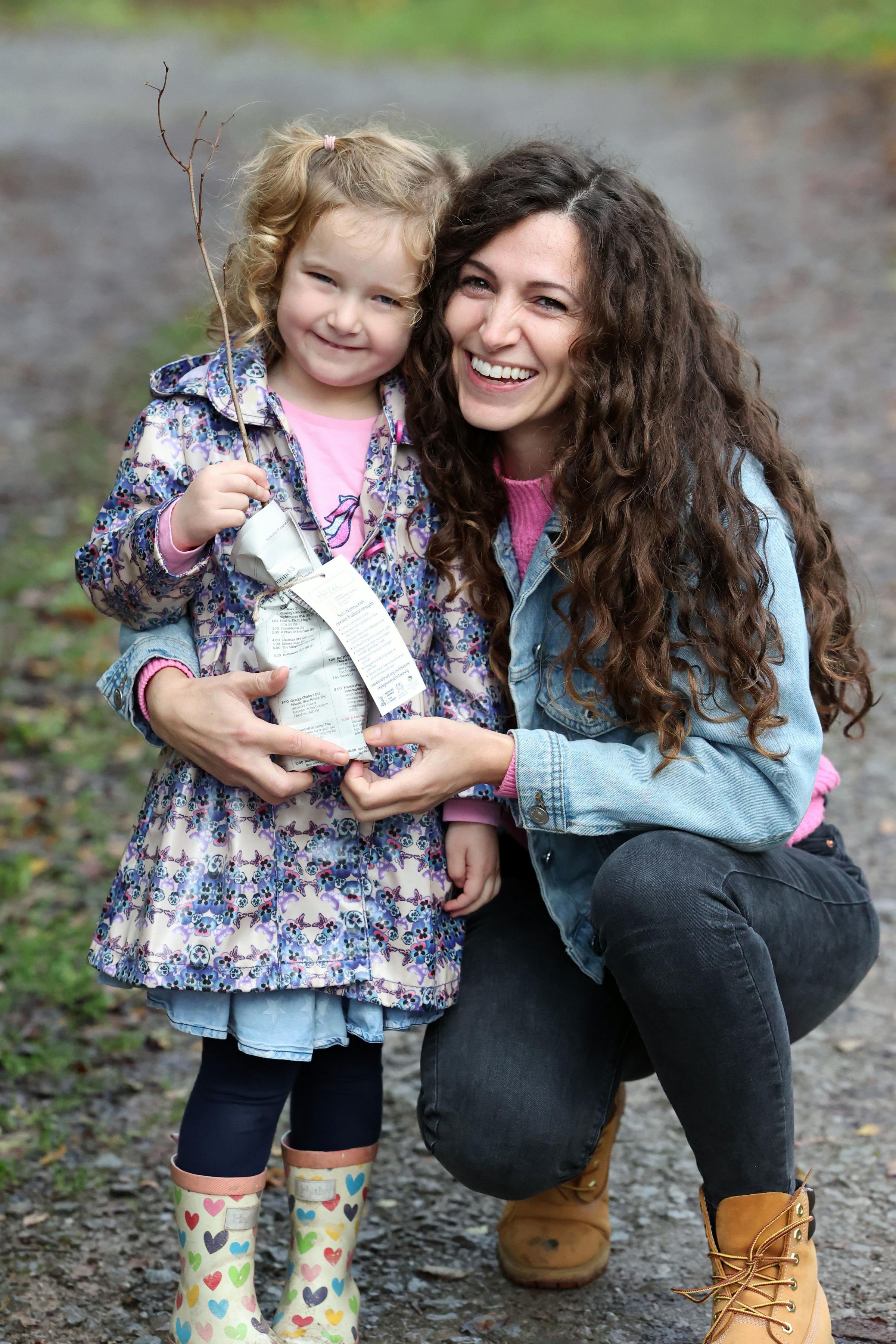 Bethan Ellis with daughter, Seren, collecting their tree sapling as part of My Tree Our Forest.