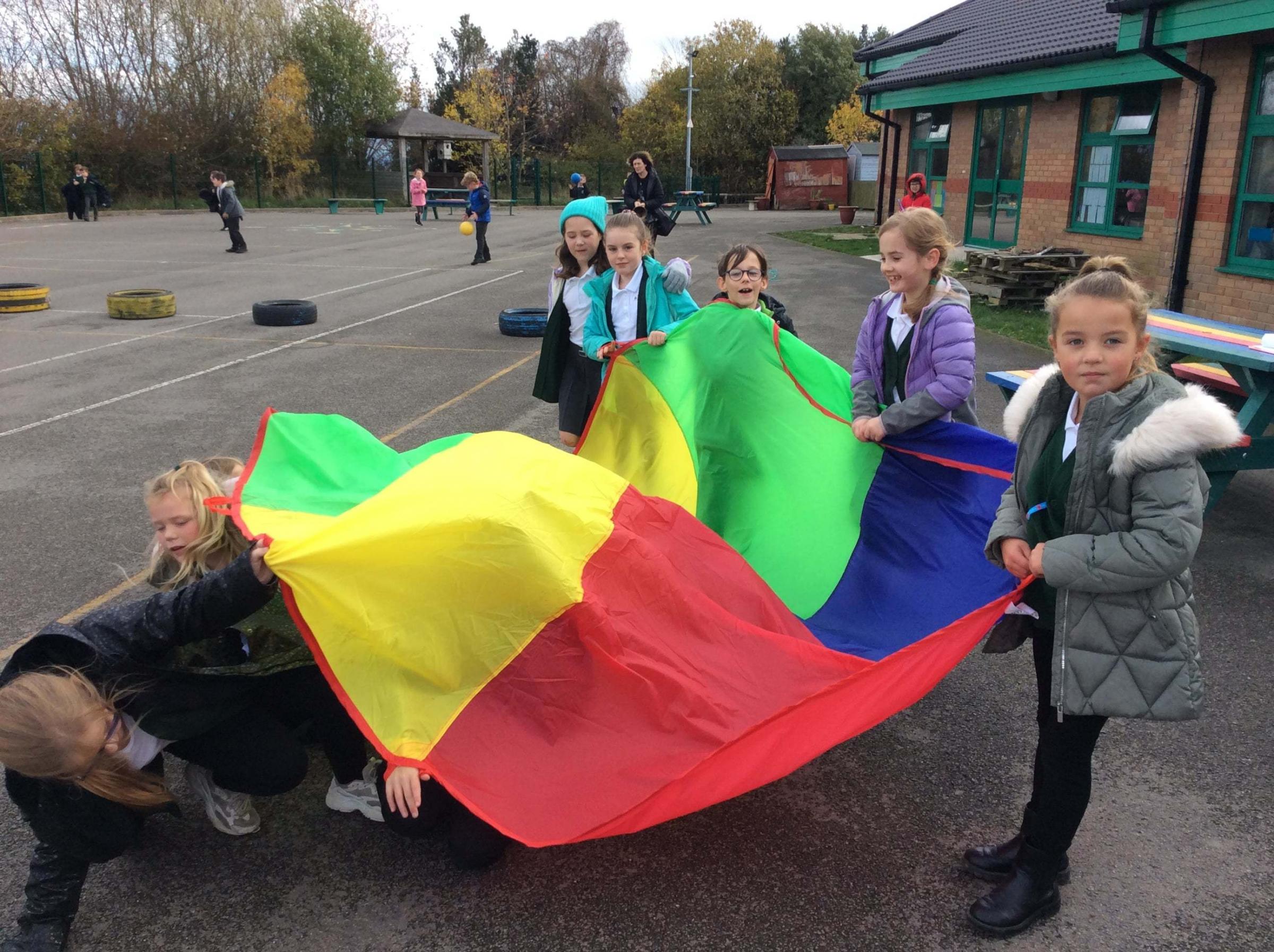 Enjoying new play equipment at Ysgol Penygelli.