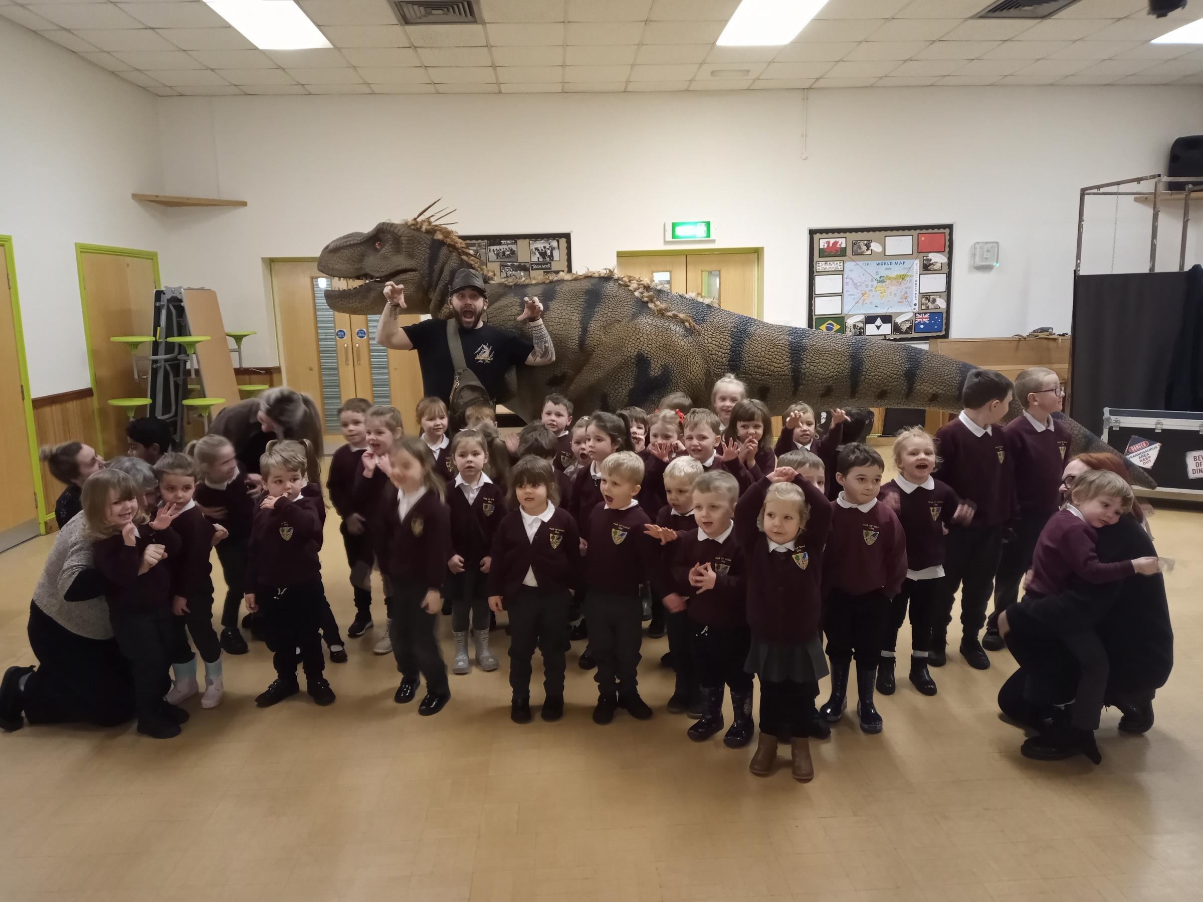 Getting up close to a t-rex with Dinomania at Park CP School, Llay.