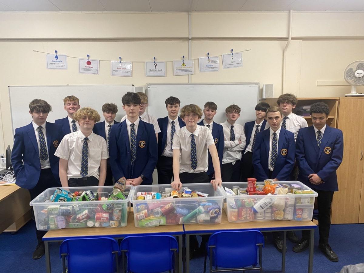 Ysgol Rhiwabon students with some of the foodbank donations.