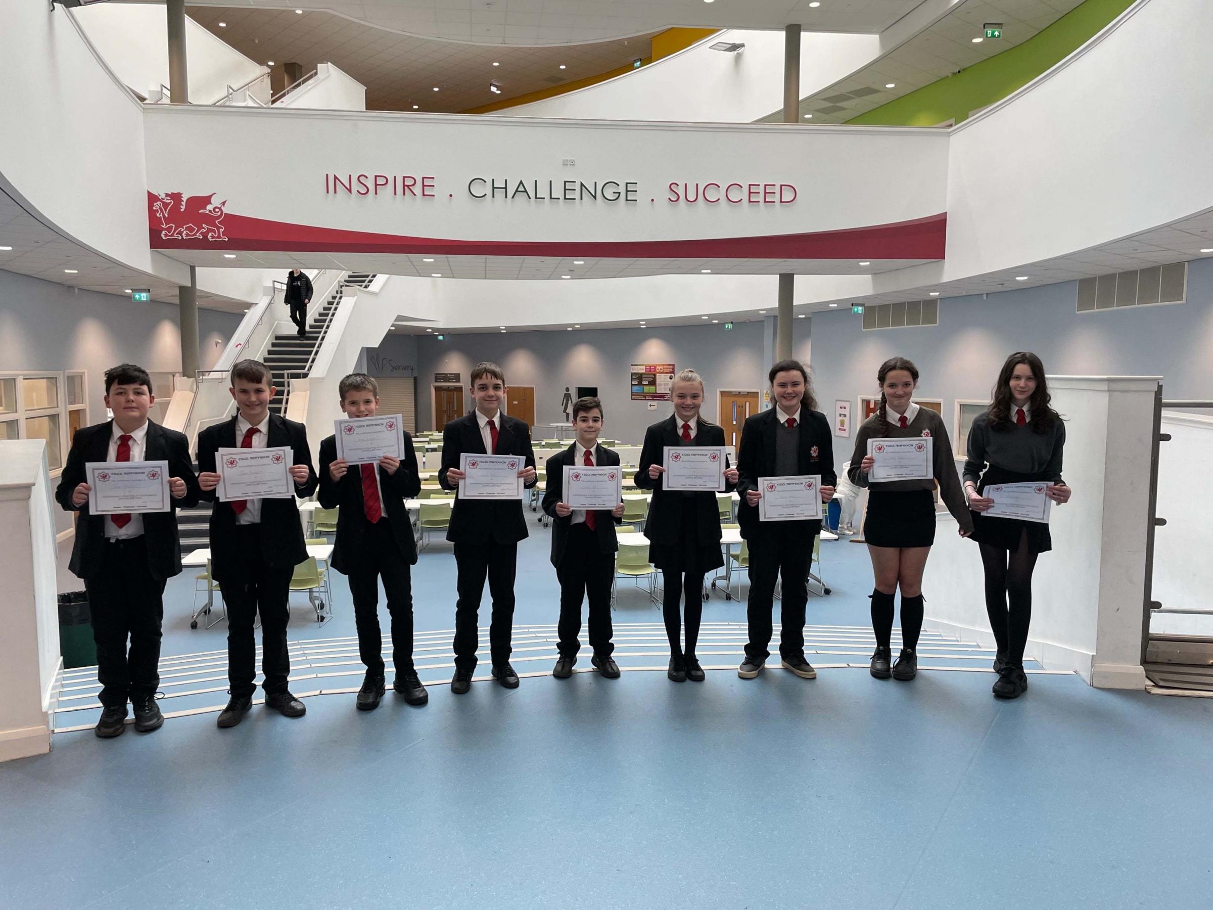 Student voice youngsters with their certificates that acknowledge their hard work.