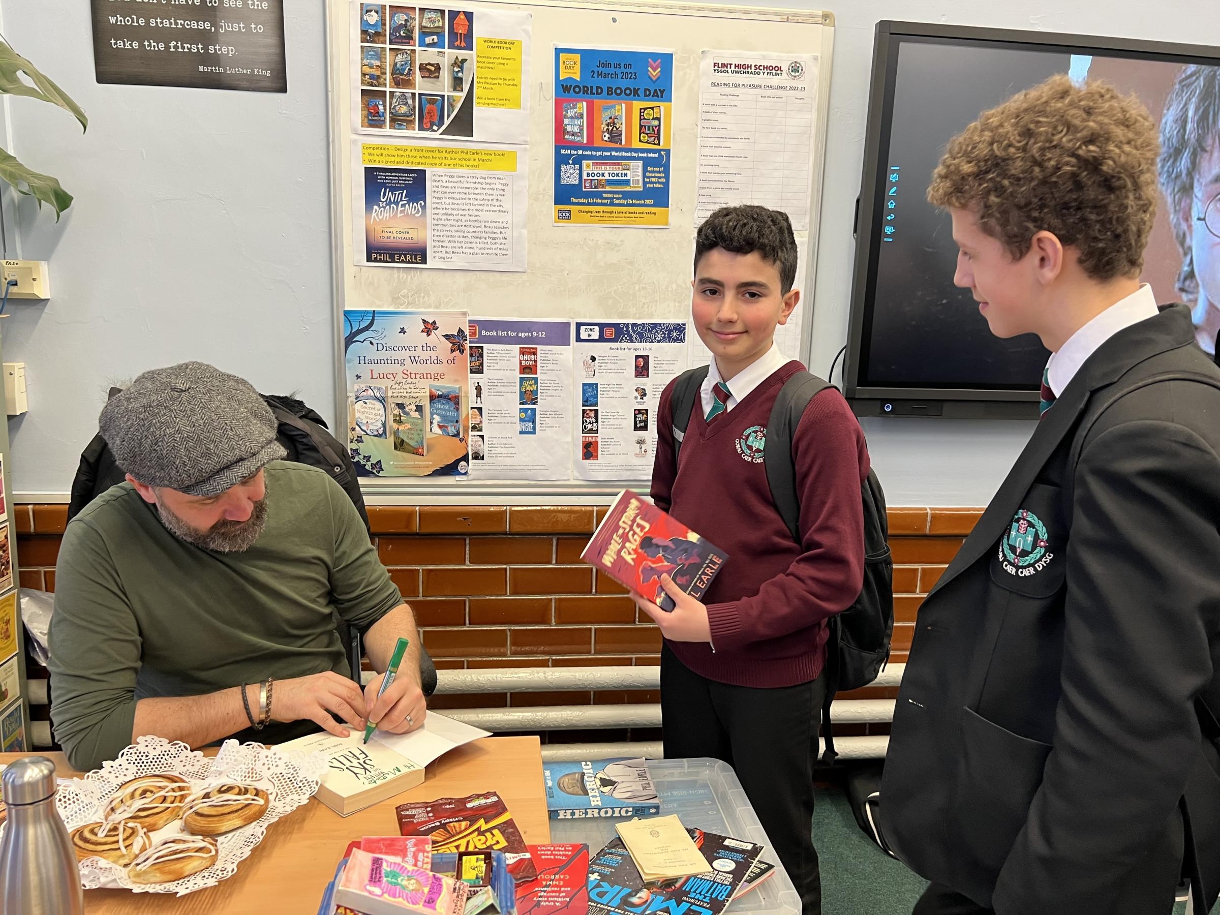 Mostafa Harba and Logan Dykins with author Phil Earle.