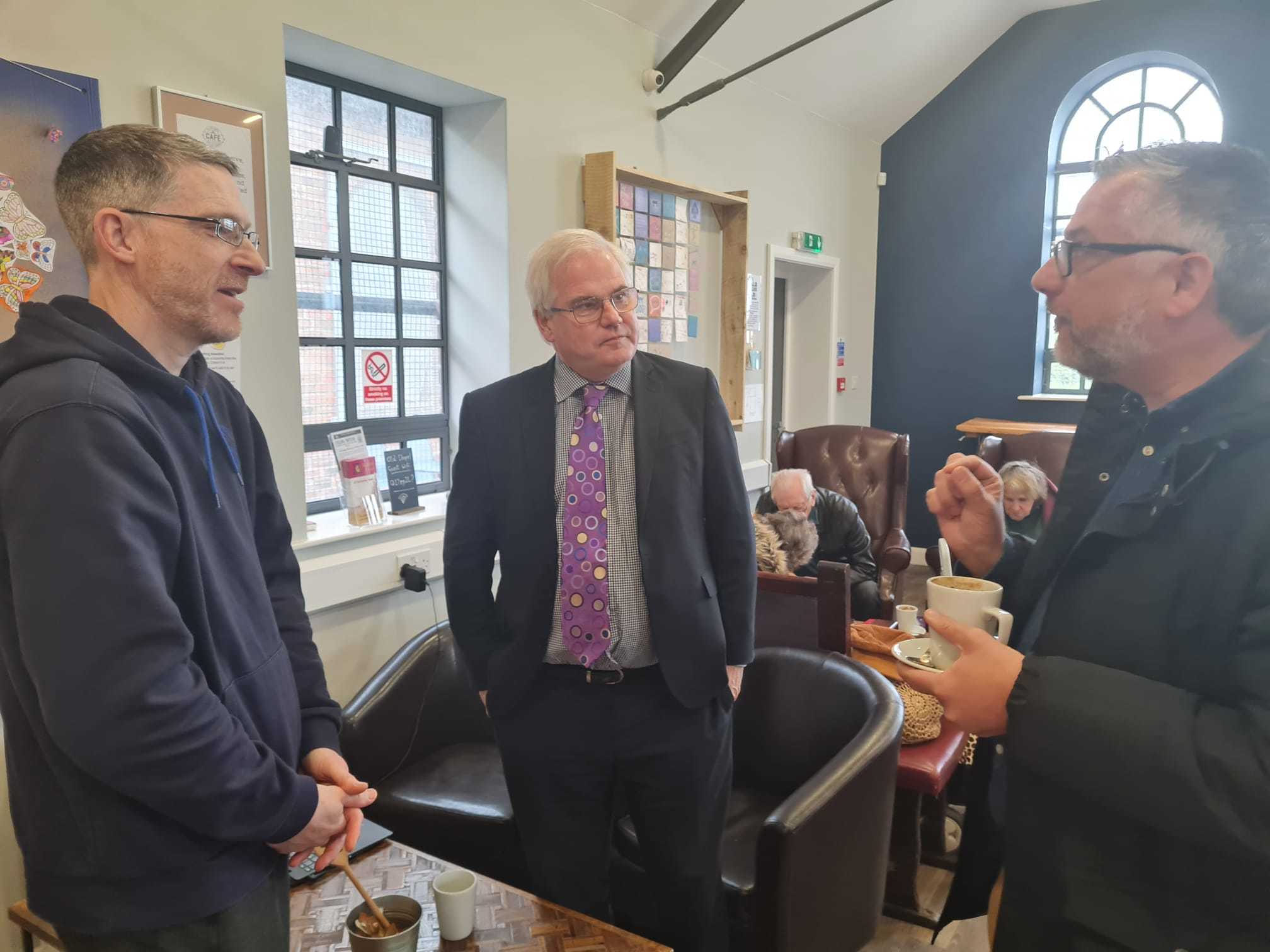 From left: Darren Ankers, Mark Tami MP and Gareth Wyn Hughes of the National Lottery Community Fund.