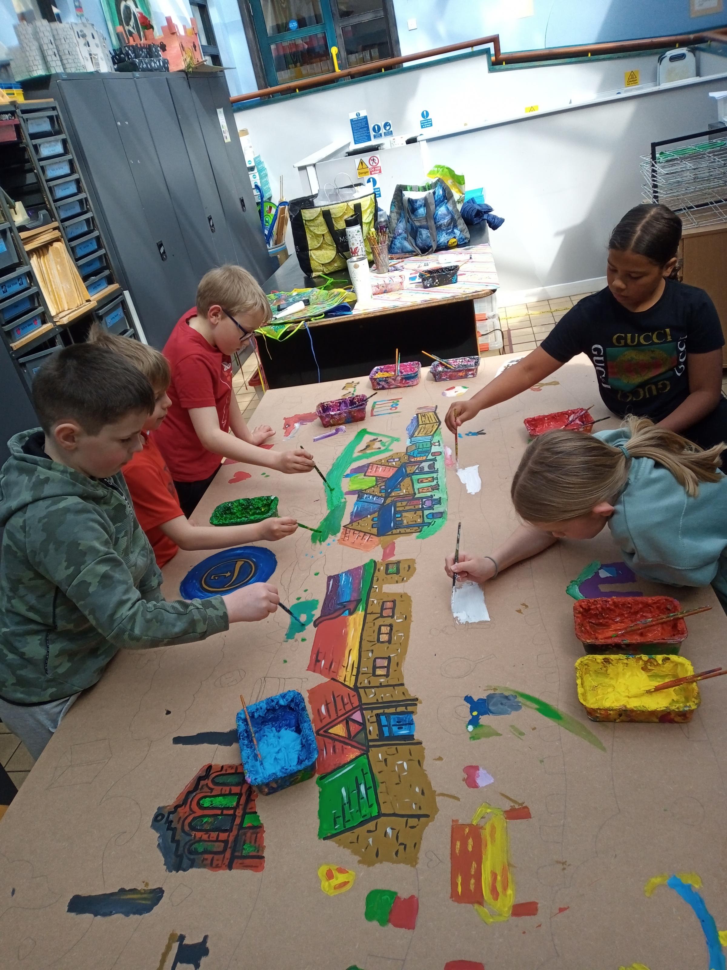 Pupils from Black Lane CP School working on the final piece for the trio of school artworks.