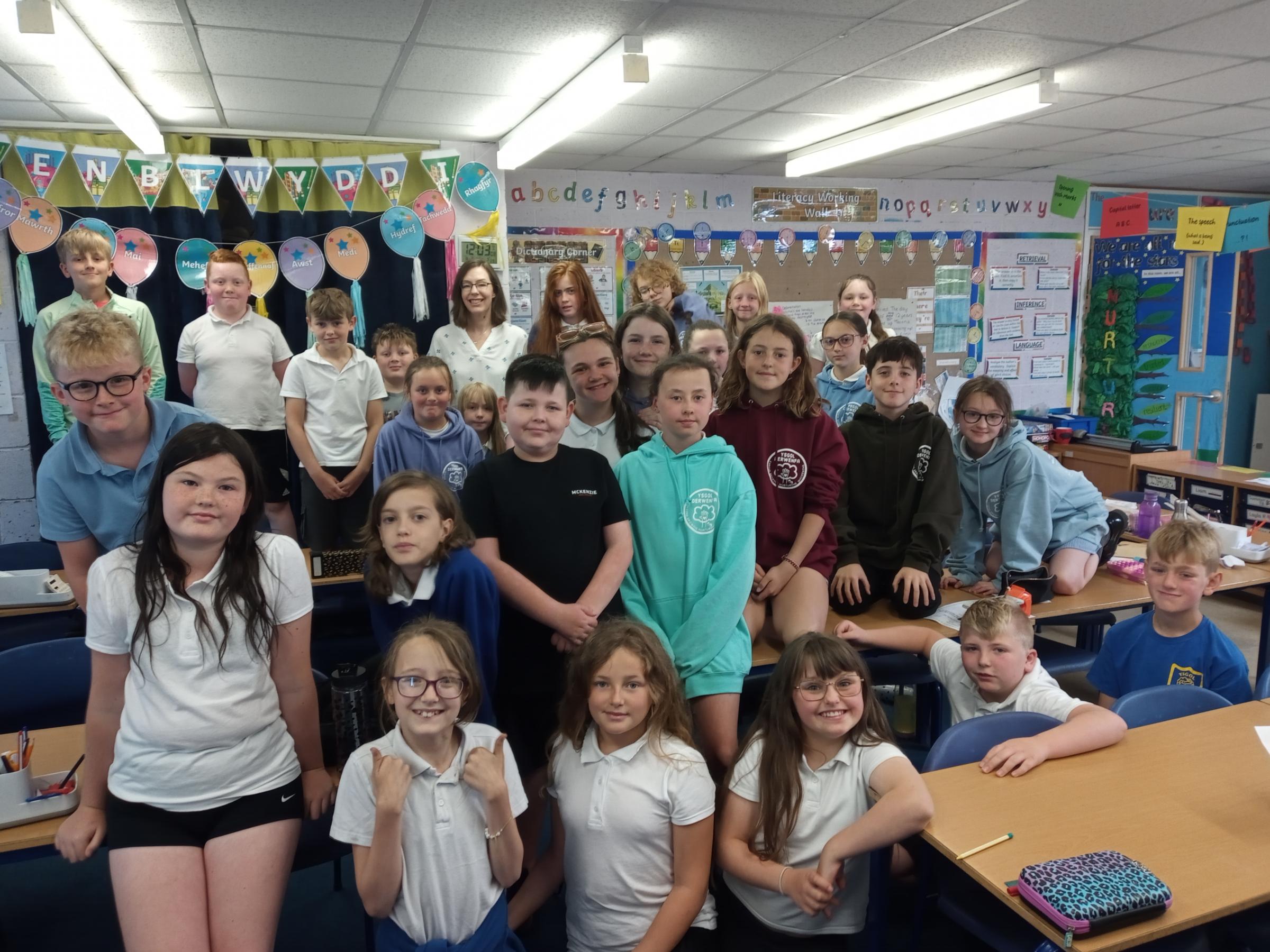 Leader community content editor Claire Pierce with Year 5/7 pupils at Ysgol Derwenfa.