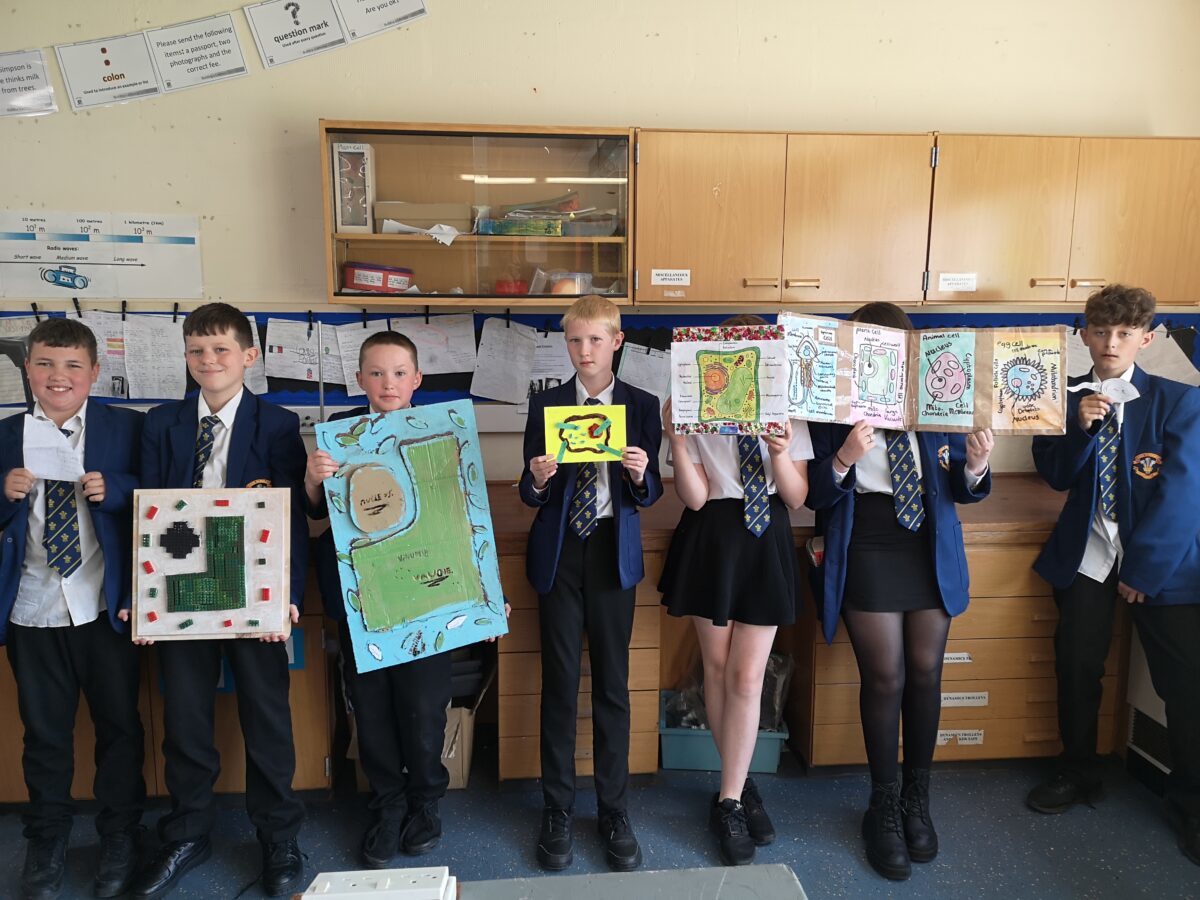  Ysgol Rhiwabon students with their science submissions.