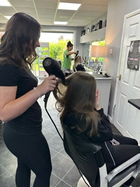 Sienna James and Jessica Vale Rowlands (in the chair) at Gina’s Hair and Beauty Salon.