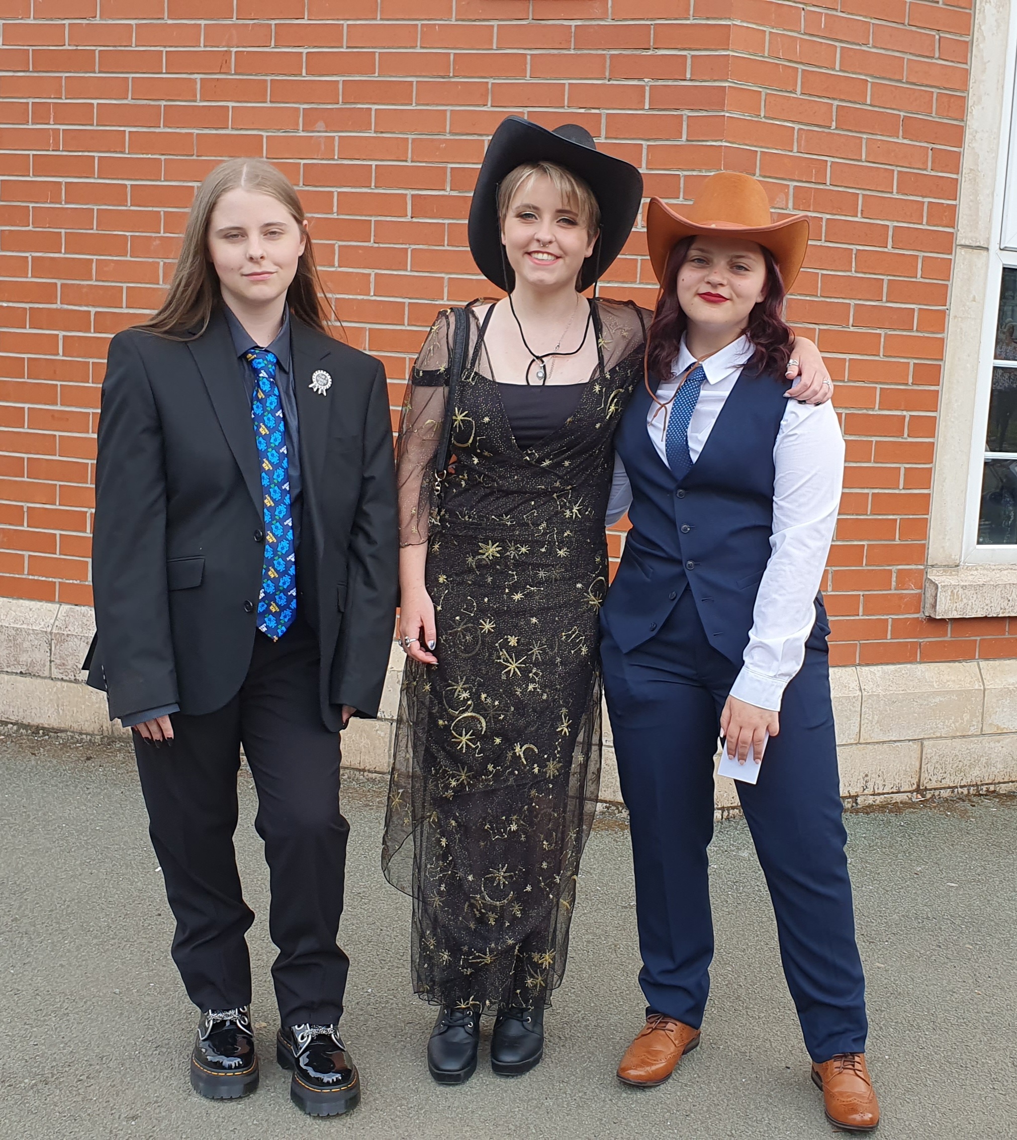 Abby Colley-Evans, Isobel Sanderson and Beth Plant outside Ysgol Rhiwabon.