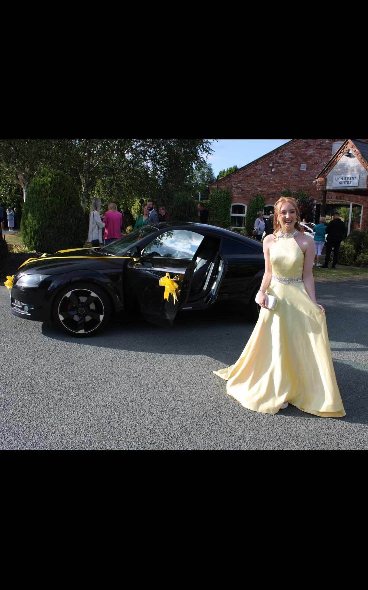 Rebecca Anne Lewis turning up to the Ysgol y Grango prom in style at Lion Quays.