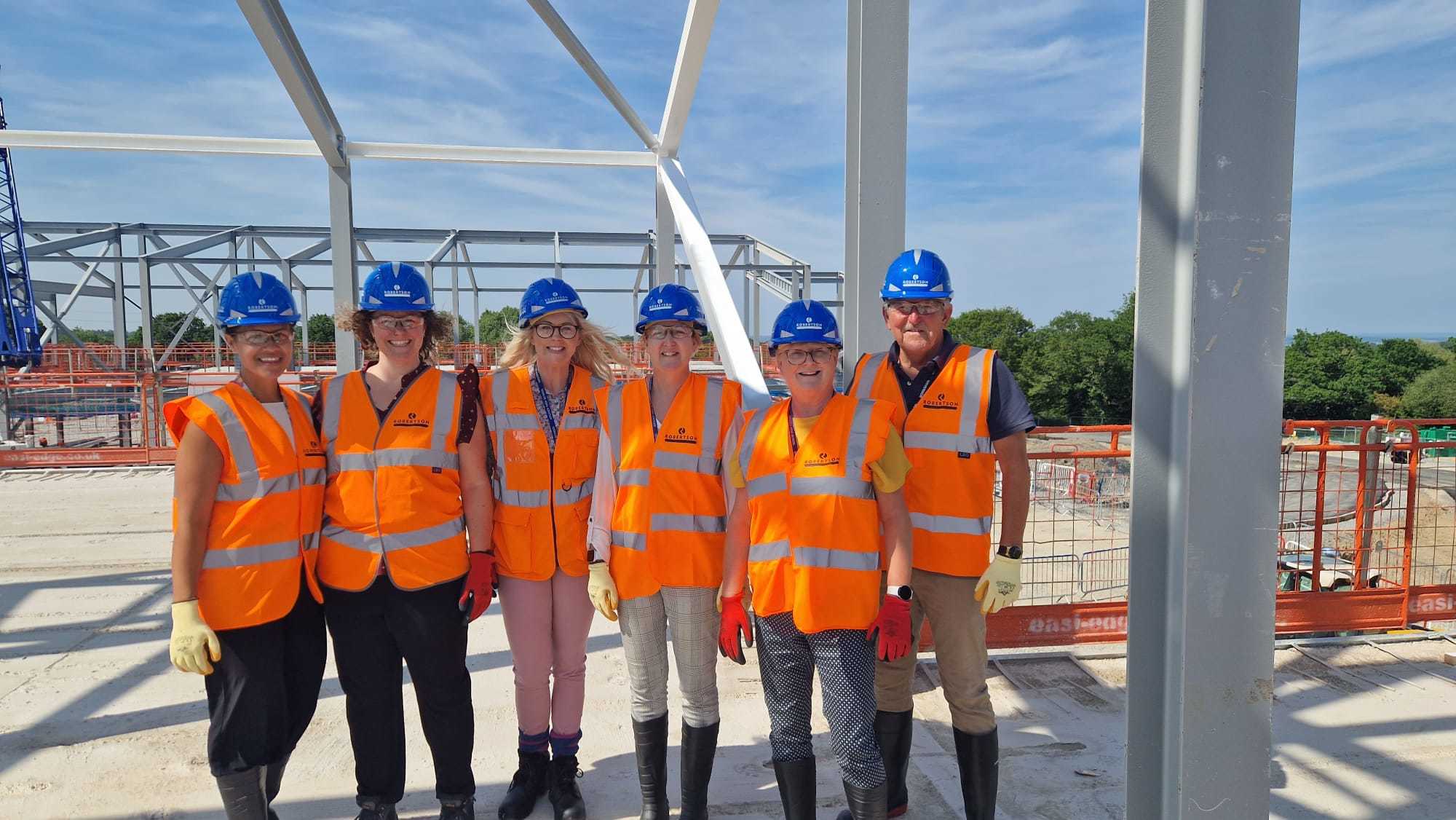 Argoed High School staff on a site tour: Beth Wellington, Heather Cadman, Anneke Perrett, Sian Williams, Jane Driffield, and Tudor Hughes (school governor).