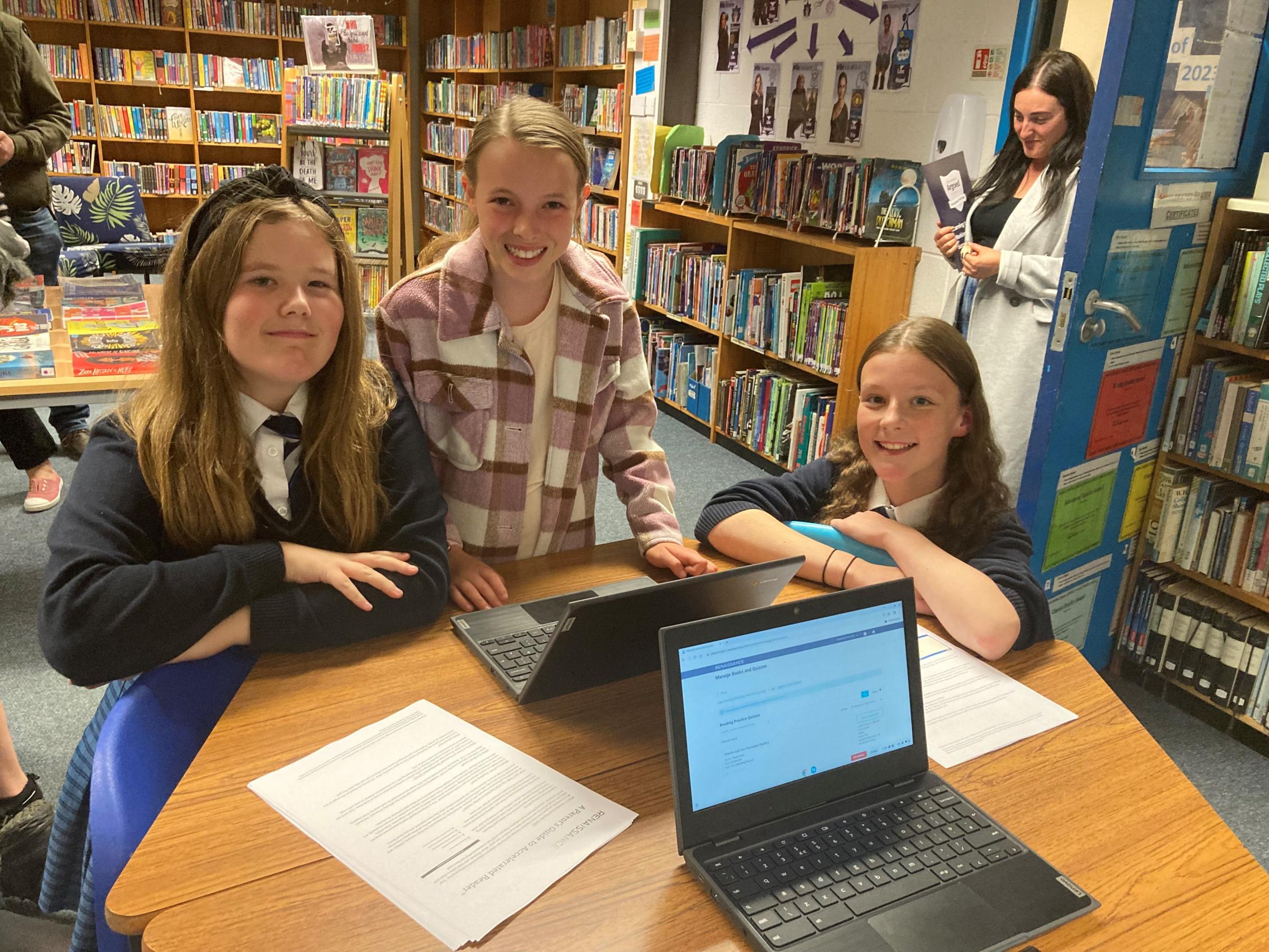 Summer Owen and Lily Robins, Year 8, demonstrate Accelerated Reader and quizzing activities in the school library.