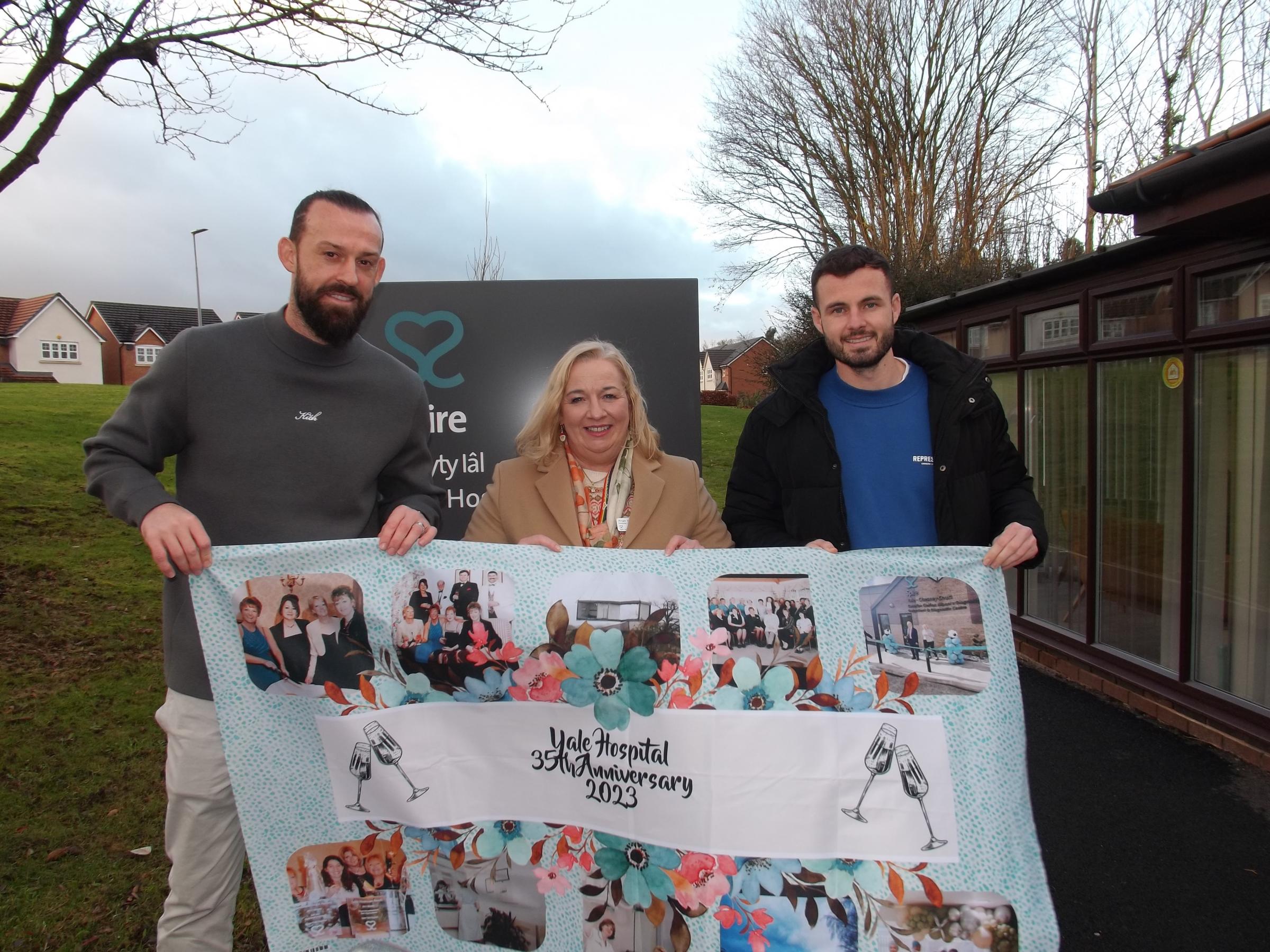 Wrexham AFC players Steven Fletcher and Anthony Forde, with hospital director Angie Wallace.