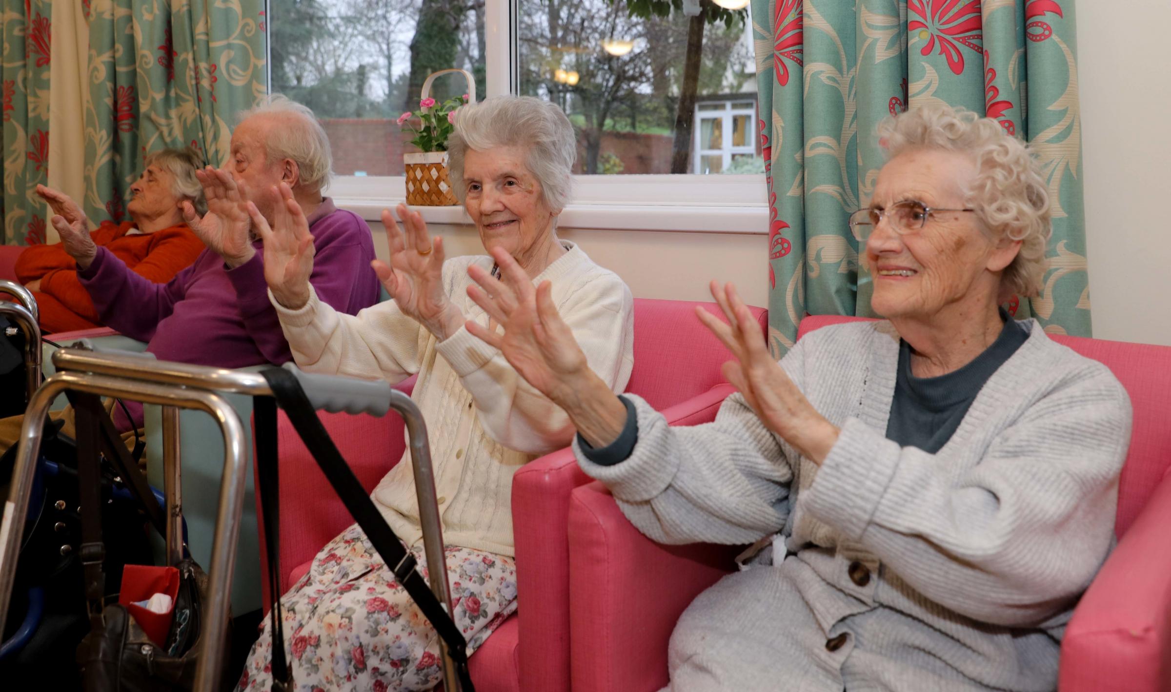 Residents sing along with the pupils.