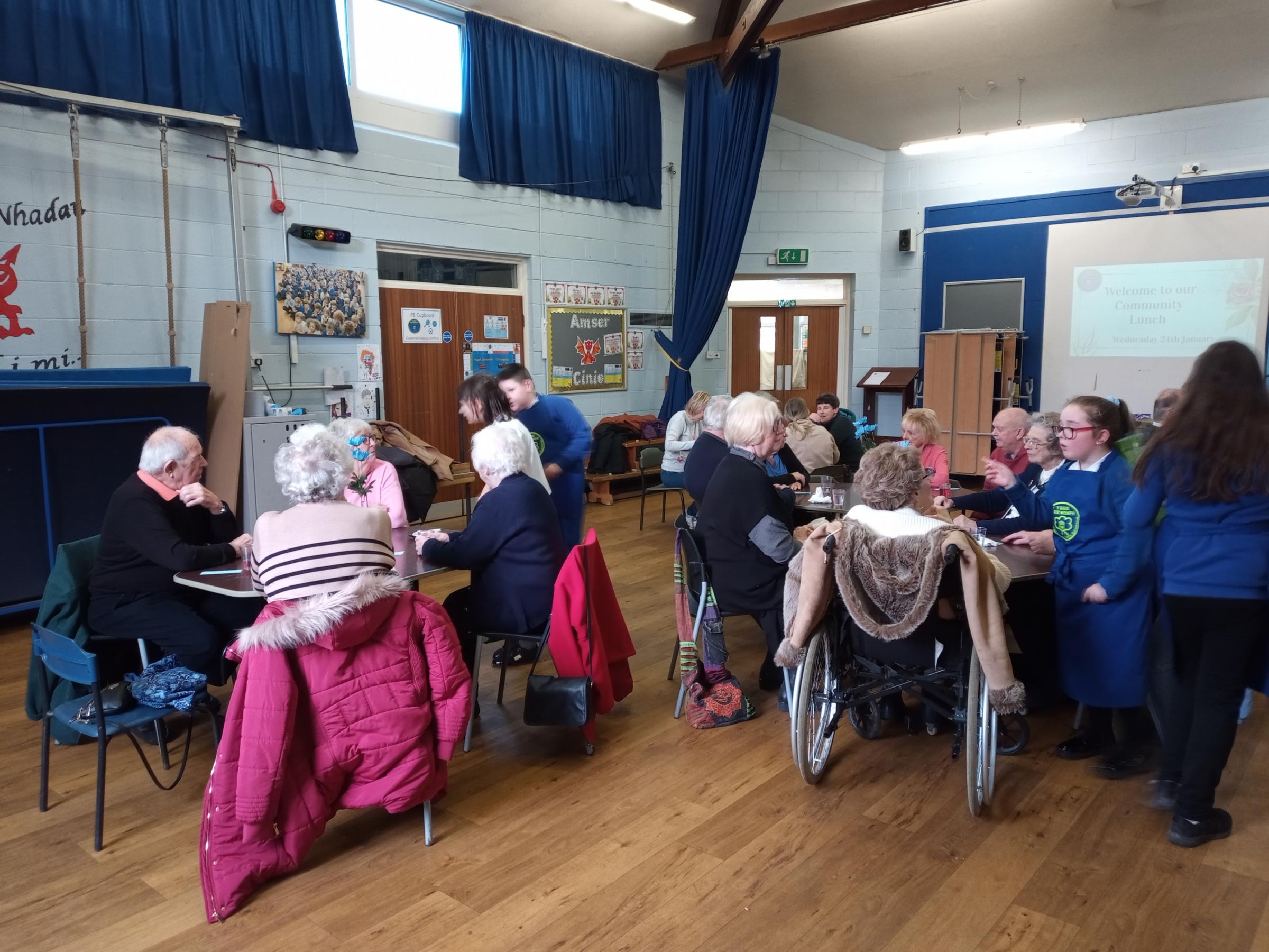 Guests enjoying their lunch at the Ysgol Derwenfa community event.