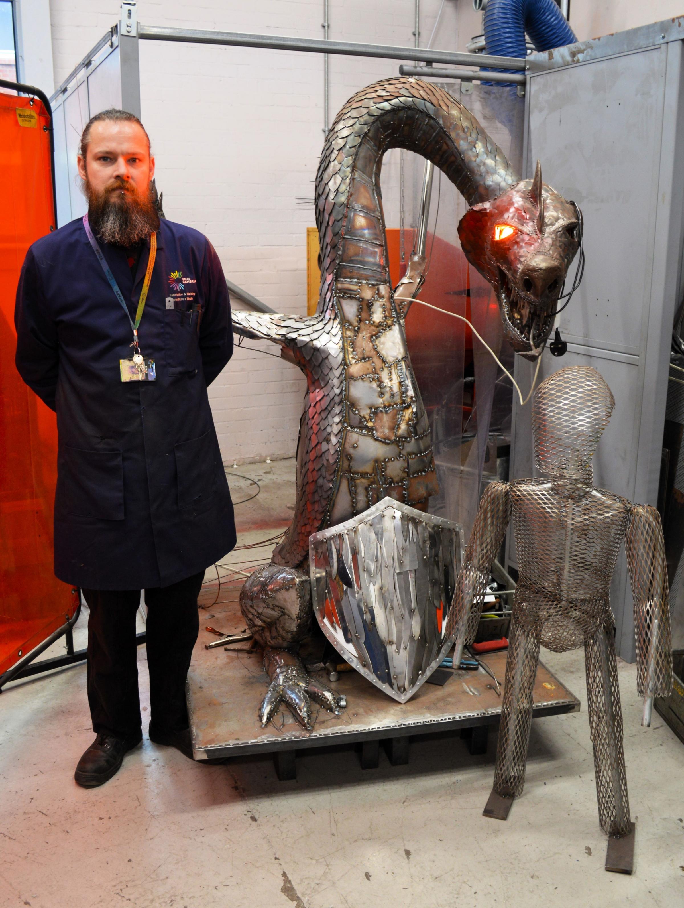 Lecturer John Freeman pictured with the Knife Dragon.