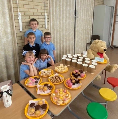 Serving tea and drinks at the schools social event.