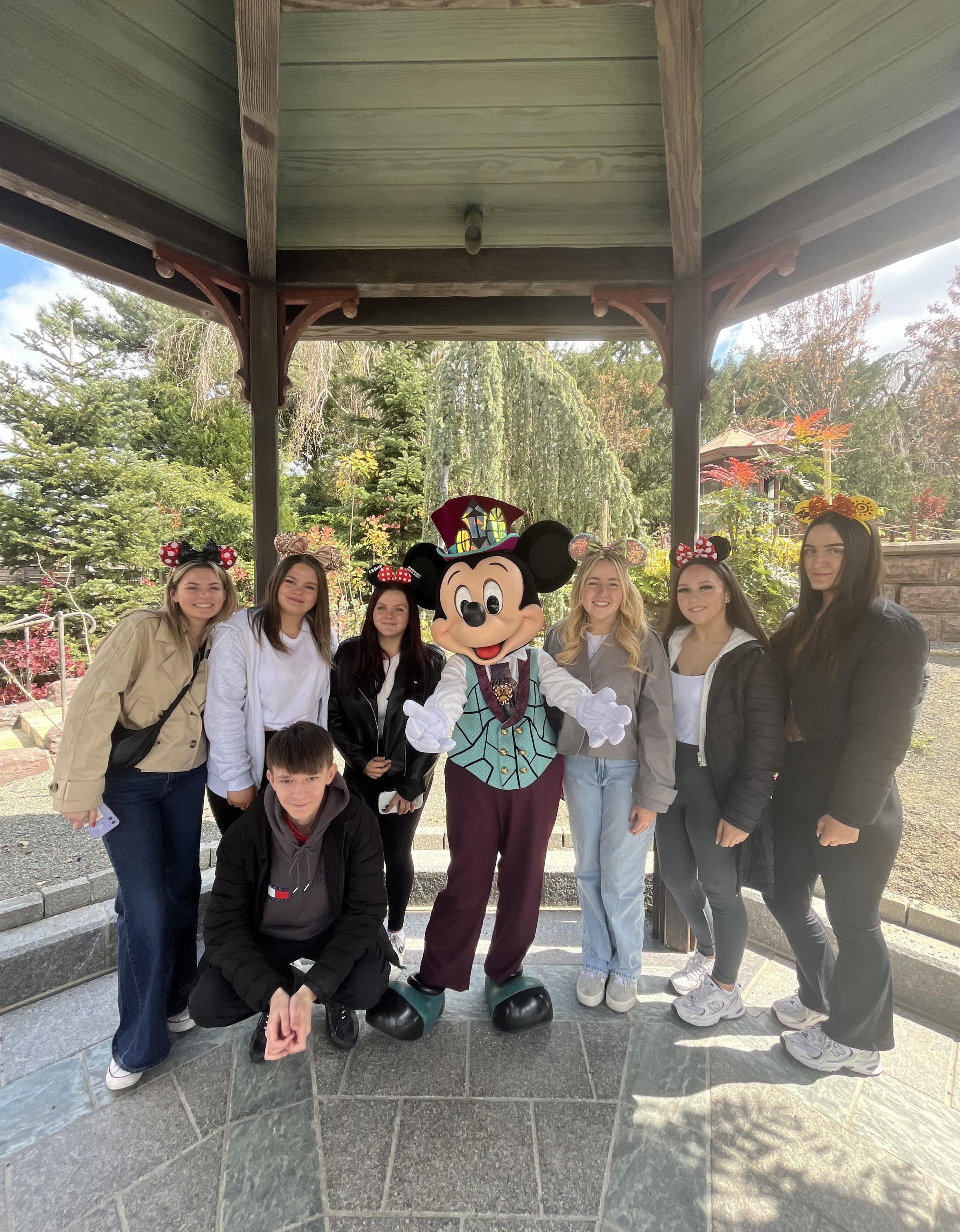 Some of the students with Mickey Mouse.
