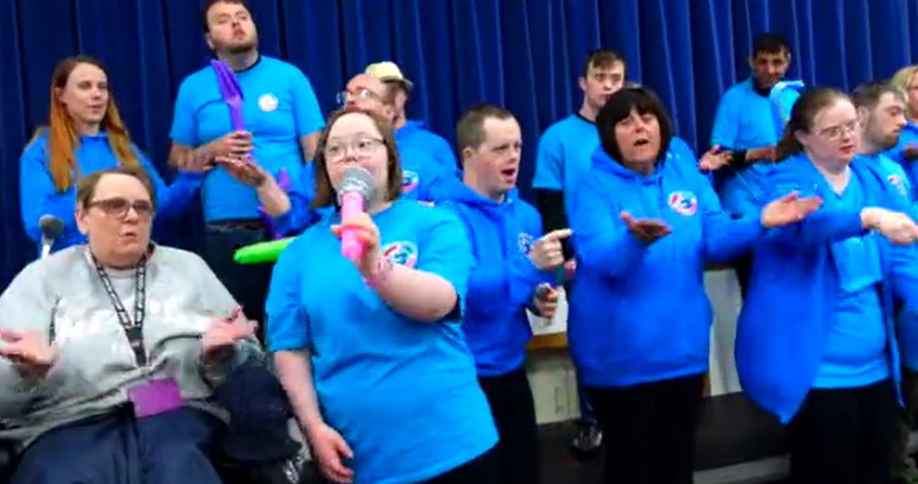 Images from the video of the CC4LD choir cllaboration with the Connahs Quay Cobras shown at Deeside Leisure Centre.