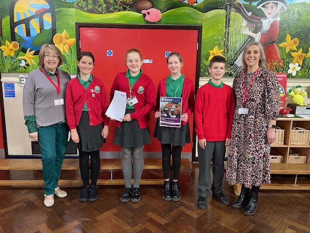 Ysgol Cefn Mawr chair of governors Christine Jones and headteacher Andrea Green, with head boy Blake, head girl Lola, and prefects Michalena and Isabel. 