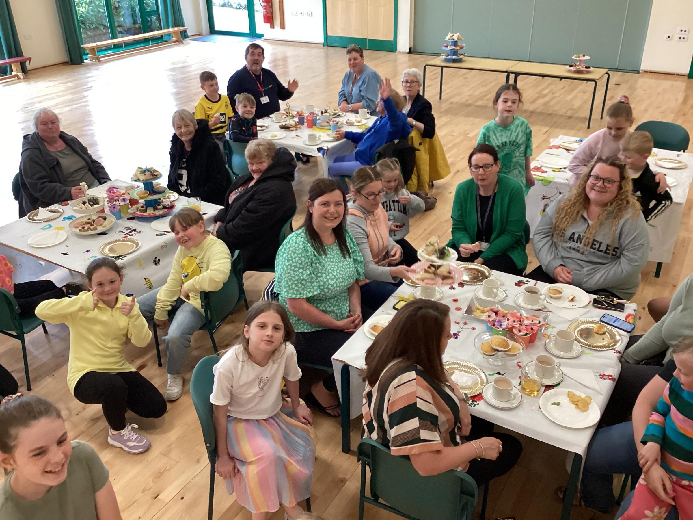 Pupils hosted afternoon tea for the community at Ysgol Penygelli.