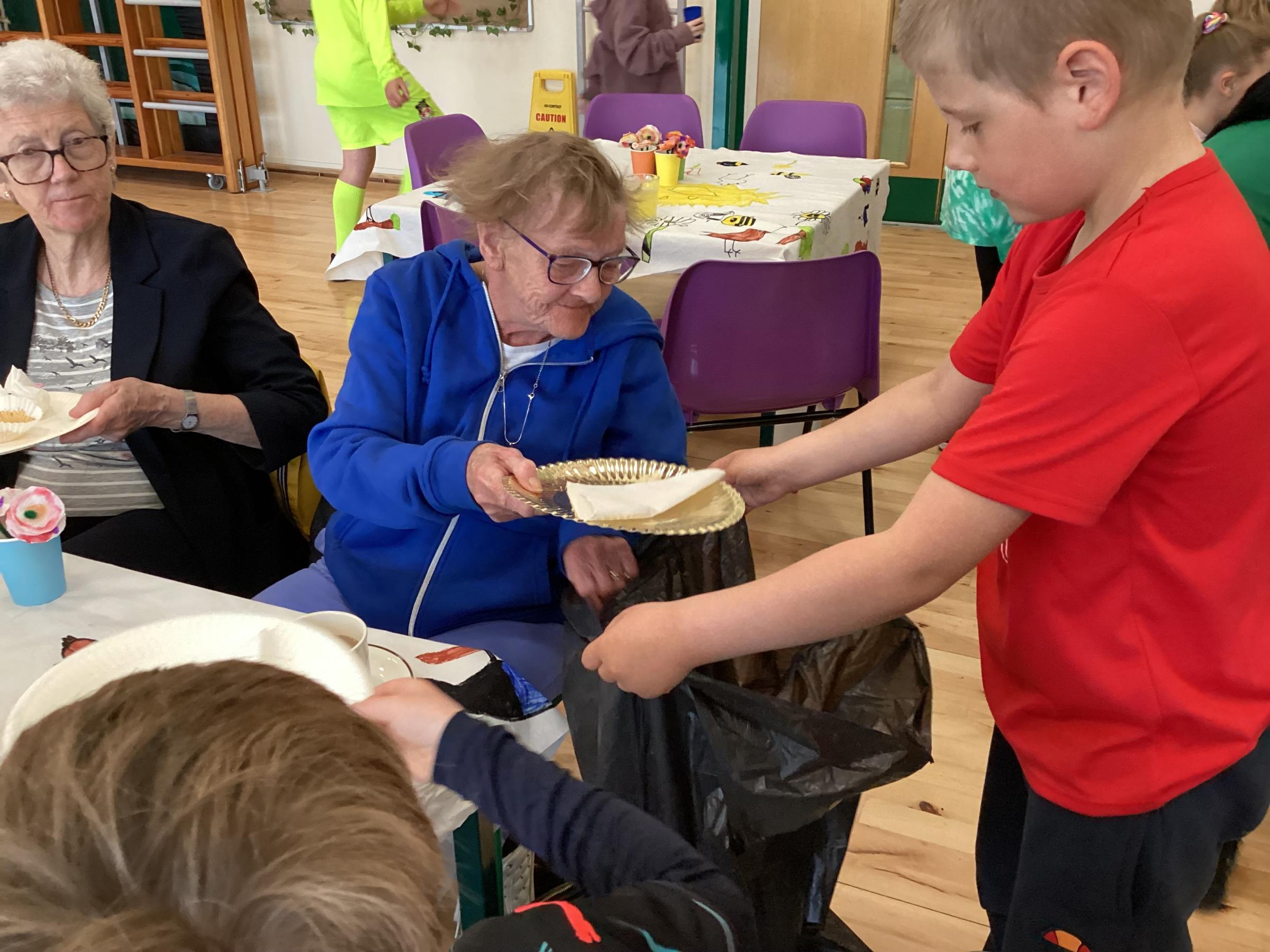 Pupils hosted afternoon tea for the community at Ysgol Penygelli.