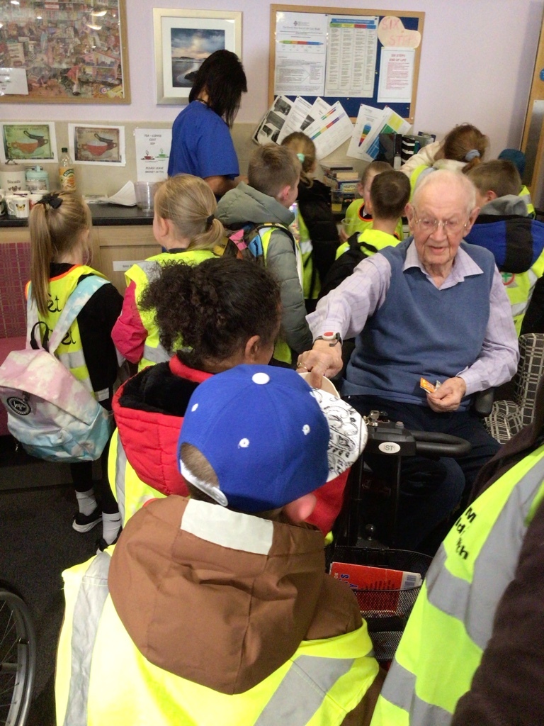 Ysgol Ty Ffynnon pupils visit residents of Llys Eleanor.