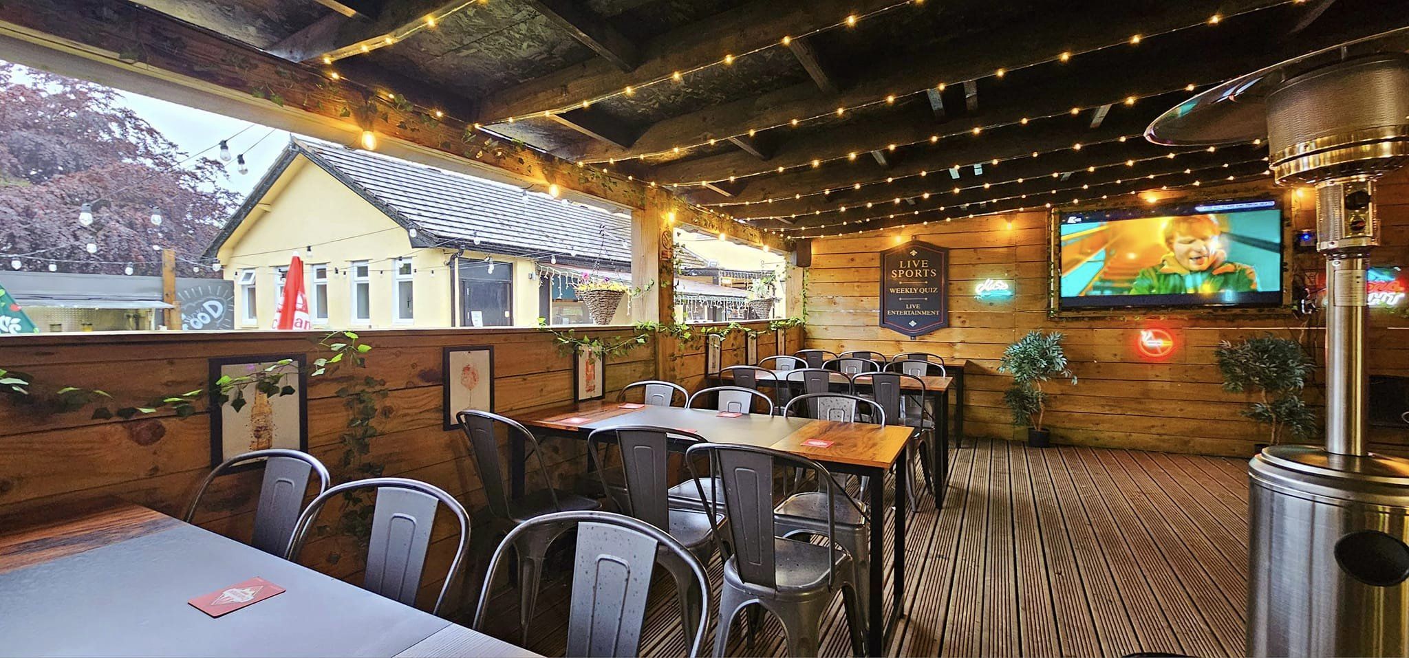Covered outdoor bar at The Burntwood, with plenty of seating.
