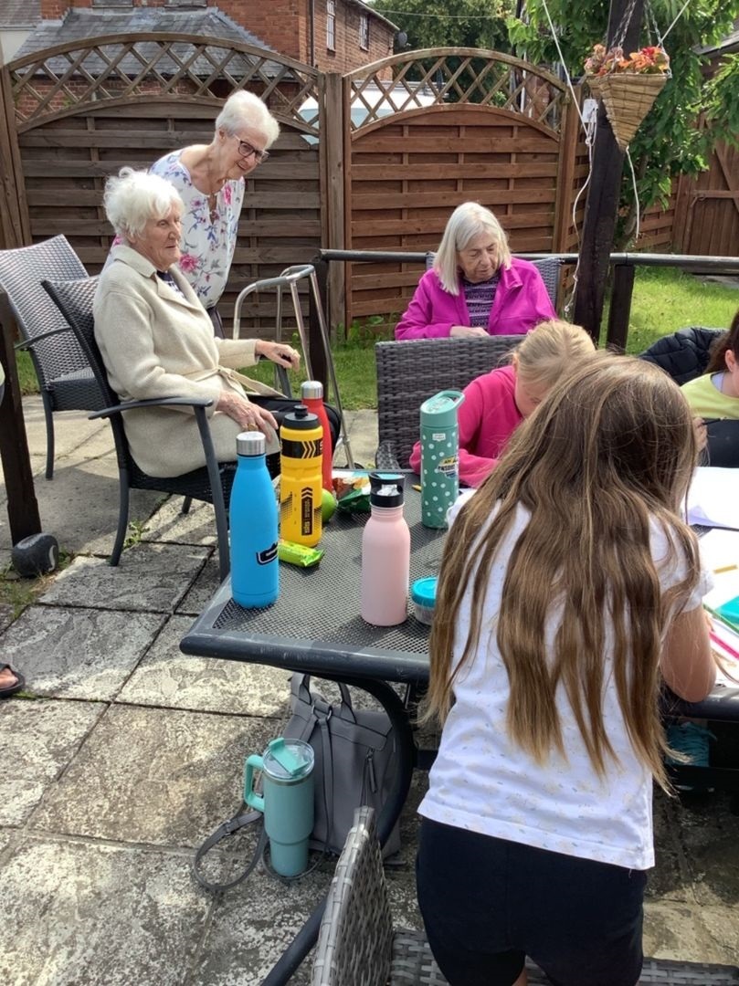 Holt CP School pupils with residents at Maesglas Care Home.