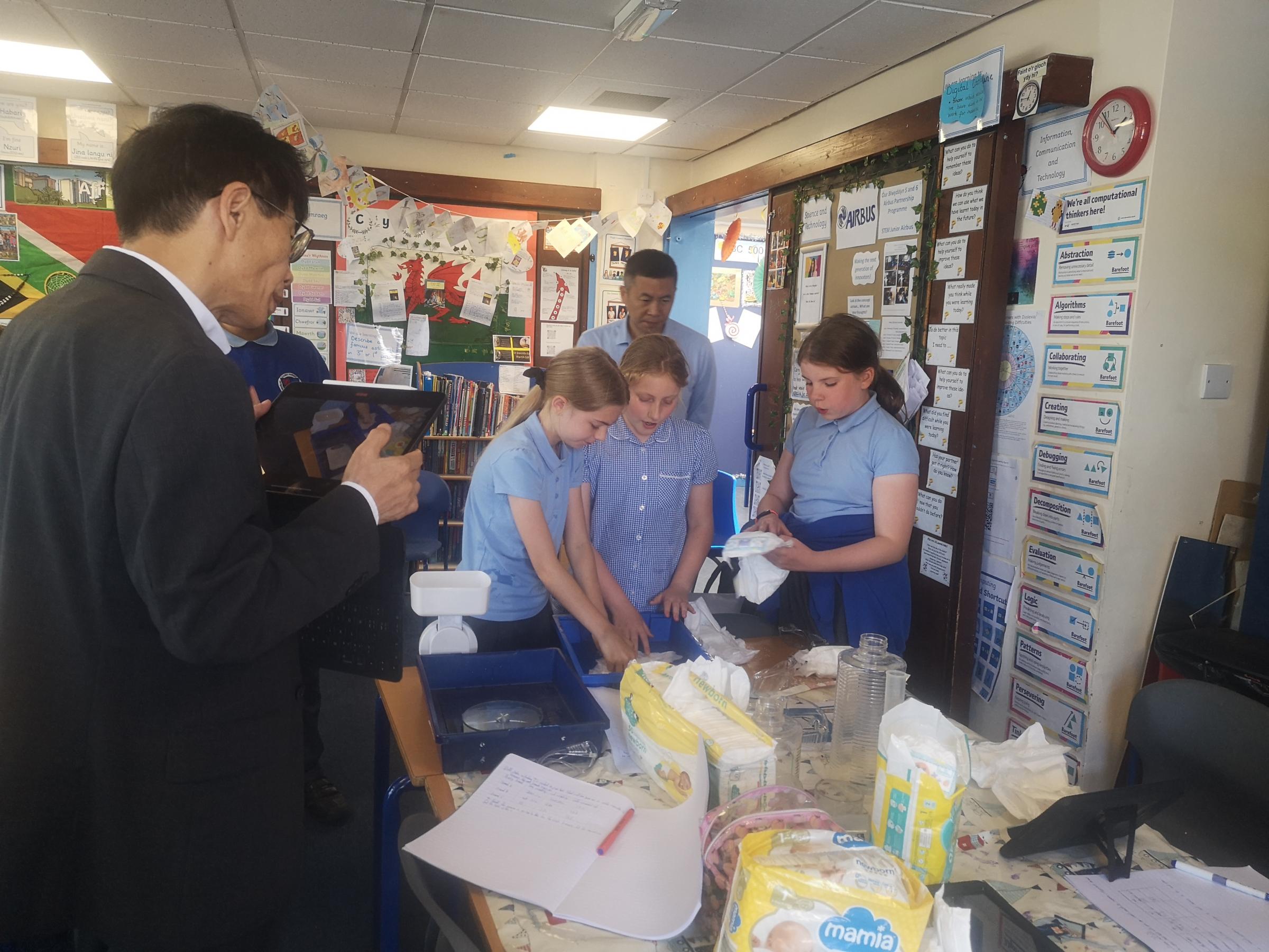 A delegation from China visited Penarlag Primary School do observe how science is taught.