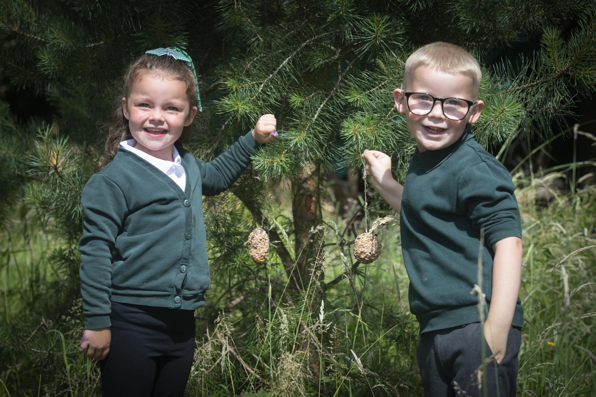 Ivy and Arthur with some of the bird feed. Photo: Mandy Jones 