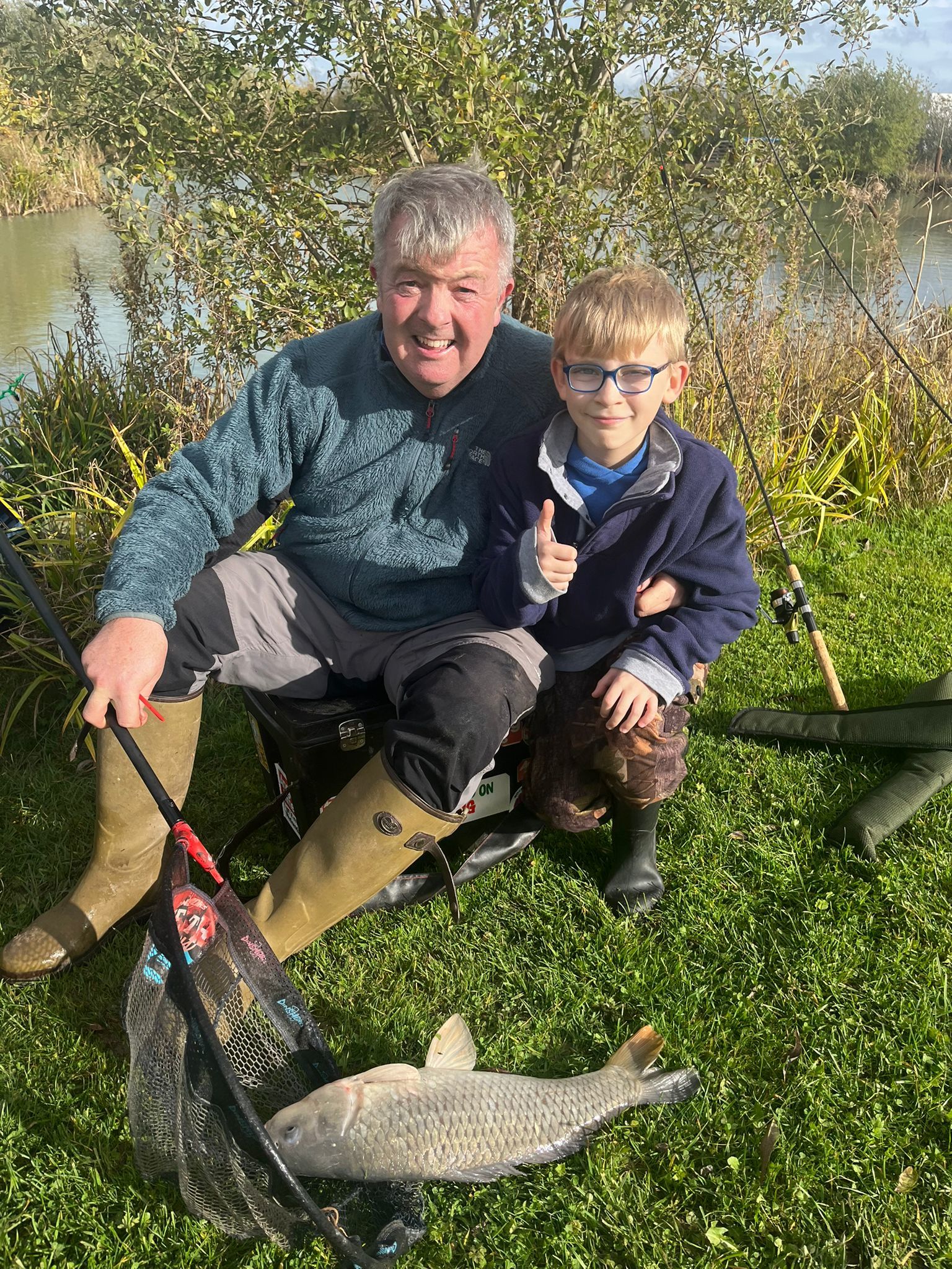 Retiring Hafod-y-Wern School headteacher Simon Edwards, angling with pupil Marshall.