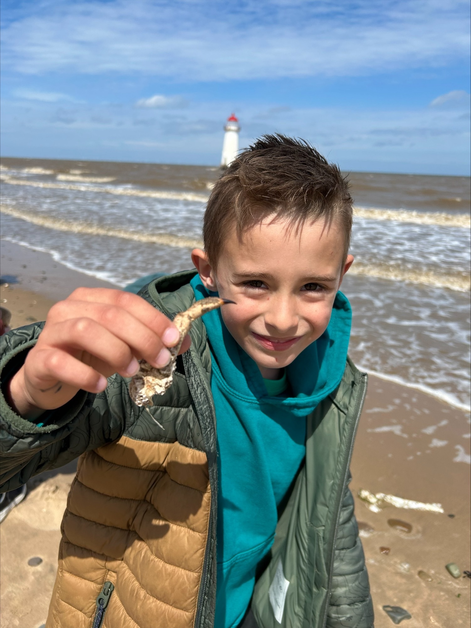 Gwyn showing off the crab claw he found.