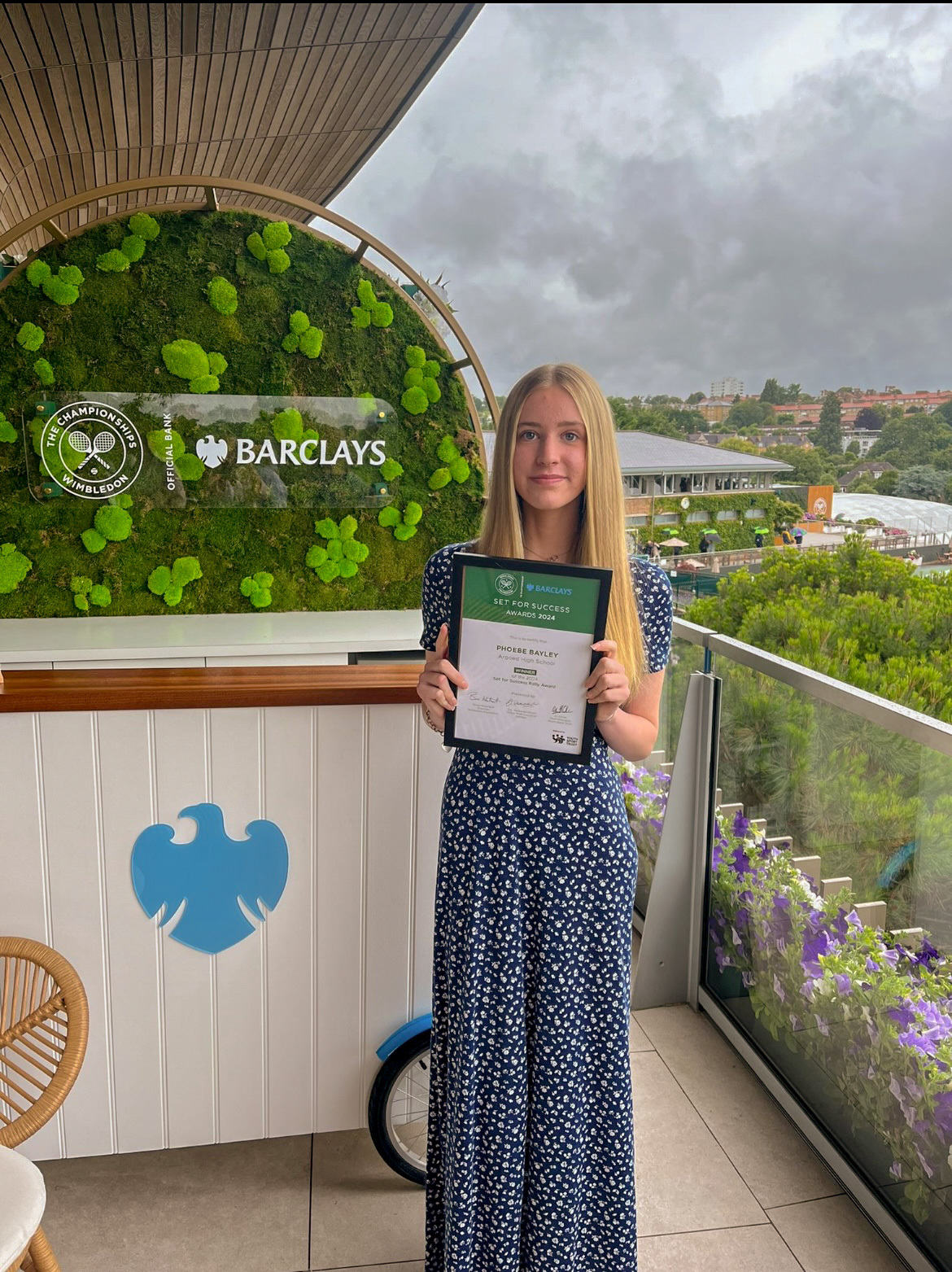 Phoebe Bayley at Wimbledon with her Rally Award.