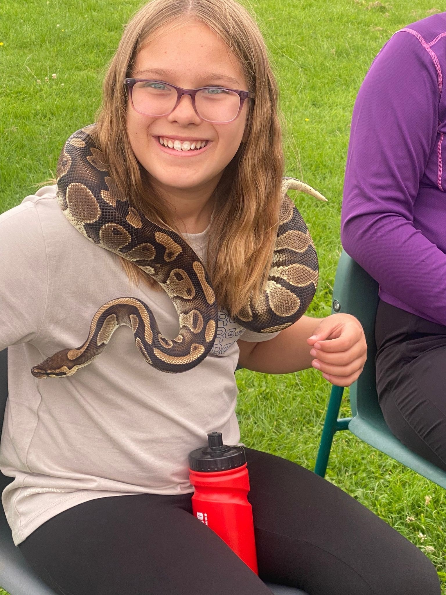 Elizabeth Hobday handles a snake. 