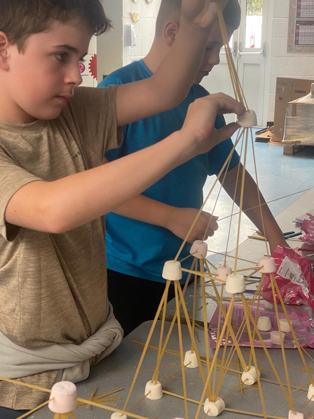 Jayden Roberts and Harrison Walker design a super structure in the Robertson Construction activity.