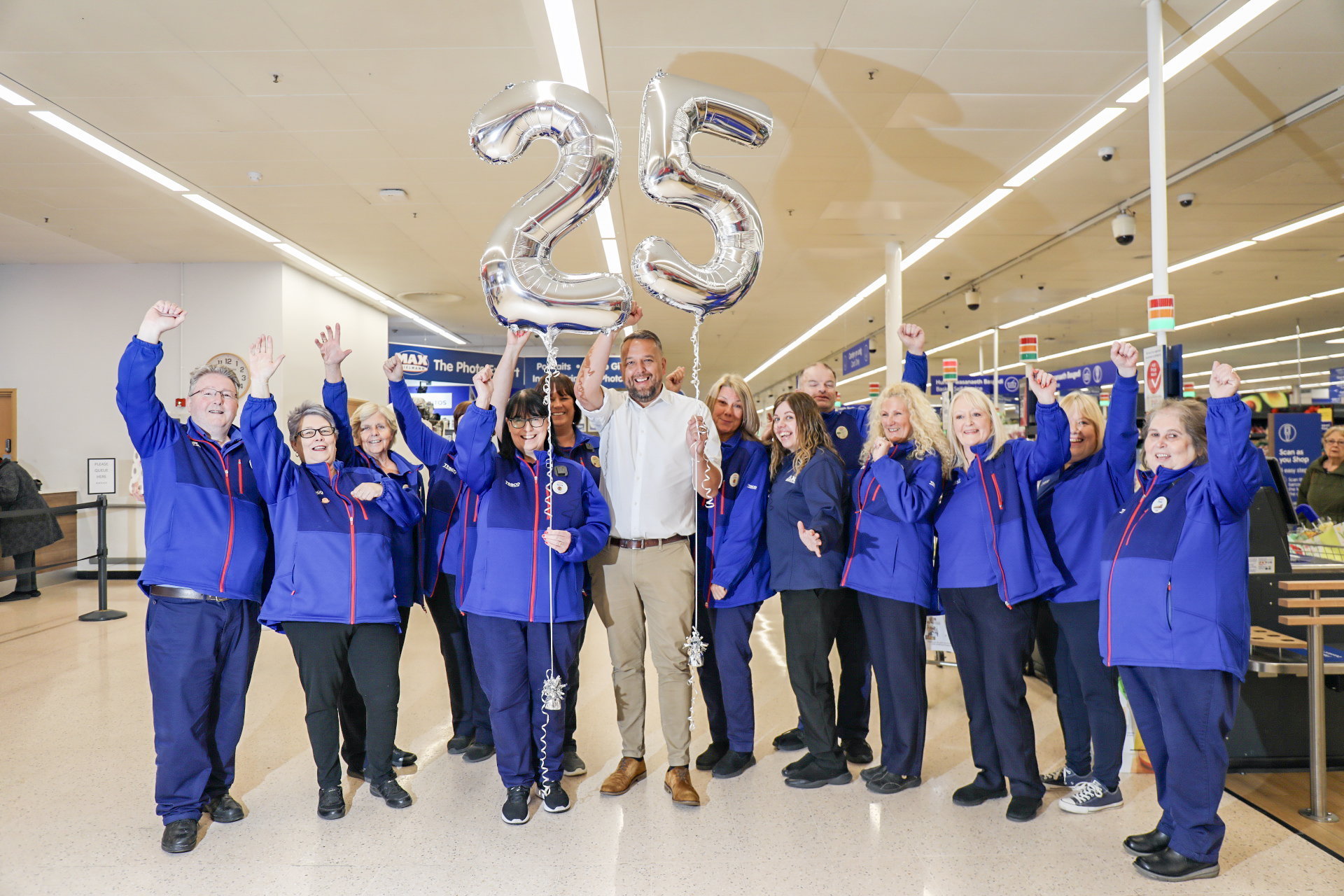 Centre manager, Alan Pruden-Barker, with long-serving Tesco colleagues.