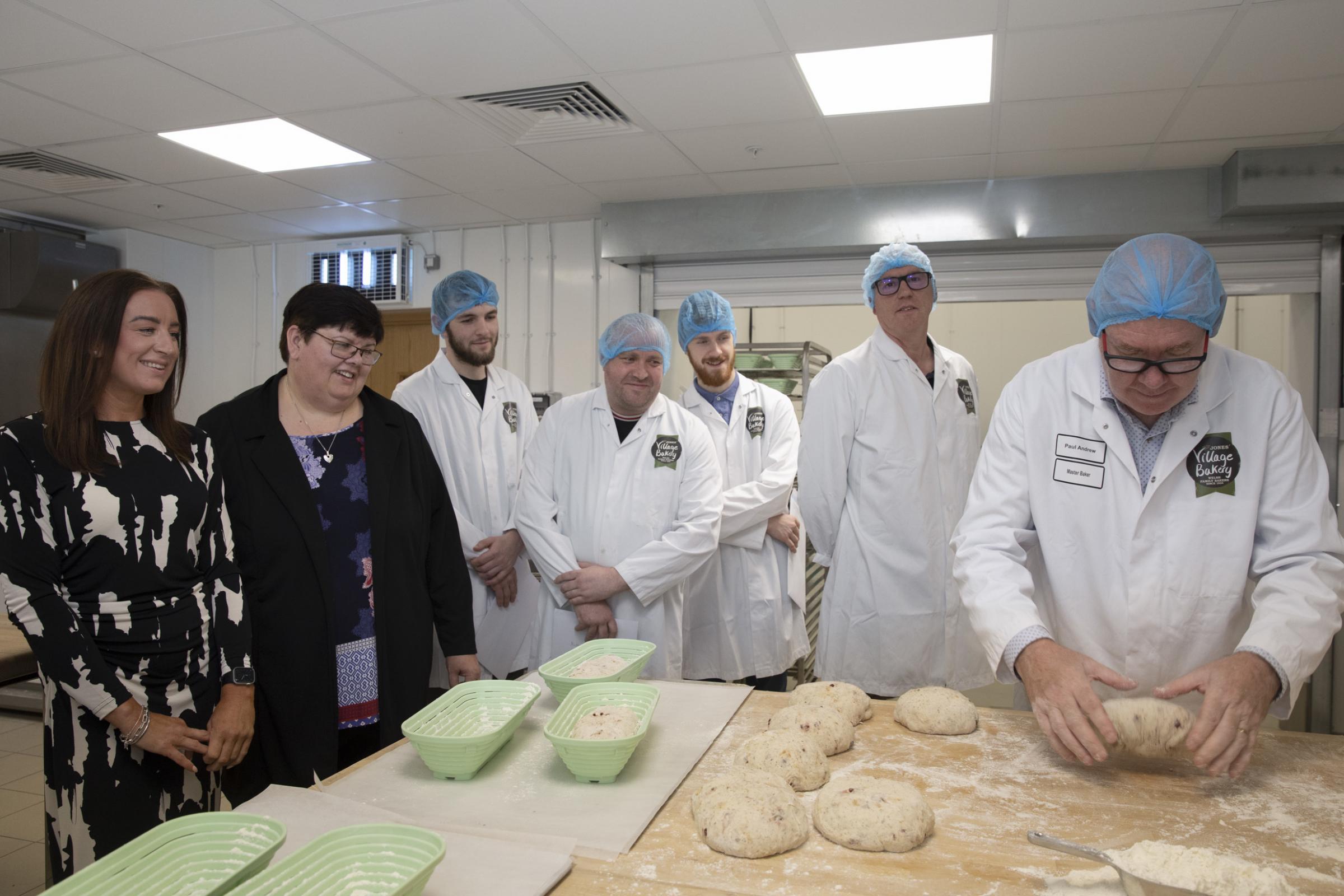 Pictured watching Paul Andrew of Village Bakery are, from left, Leanne Bell, Yvonne Evans of Coleg Cambria, Rhys Keight, Matty Wright, Dan Roberts and Matt Ennis. Photo: Mandy Jones